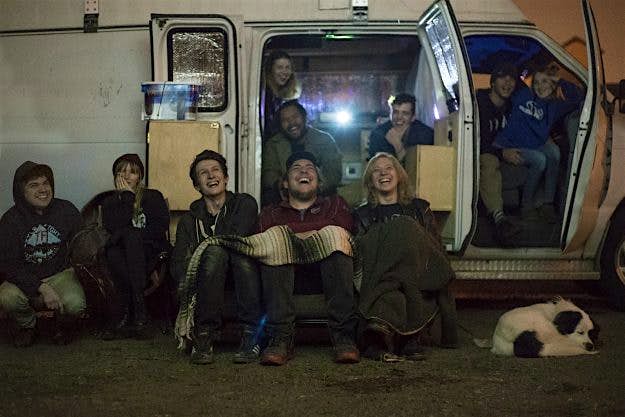 Travel News - BoQCZ3J Adam and friends watching a movie on the side of a tractor trailer.
