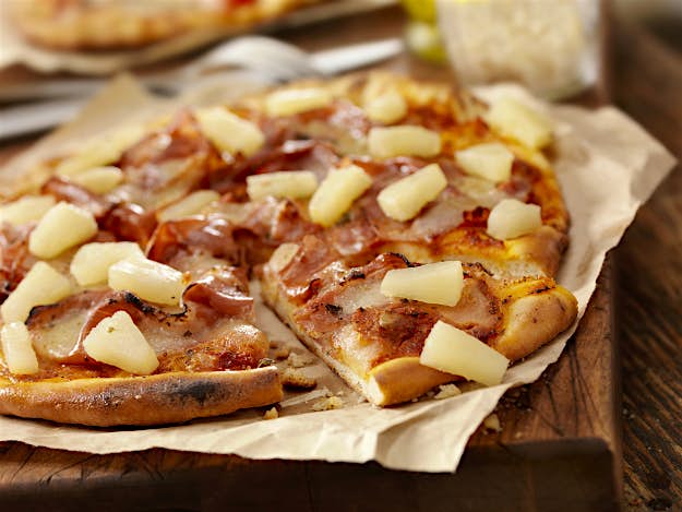 Travel News - GettyImages-184960873 Hawaiian pizza with pineapple on top.
