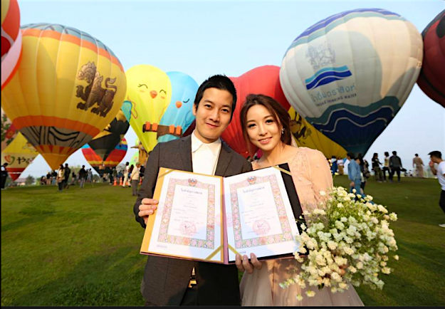 Travel News - Twenty-two couples say ‘I do’ in hot air balloons over Chiang Rai. Image: Singha Park, Chiang Rai