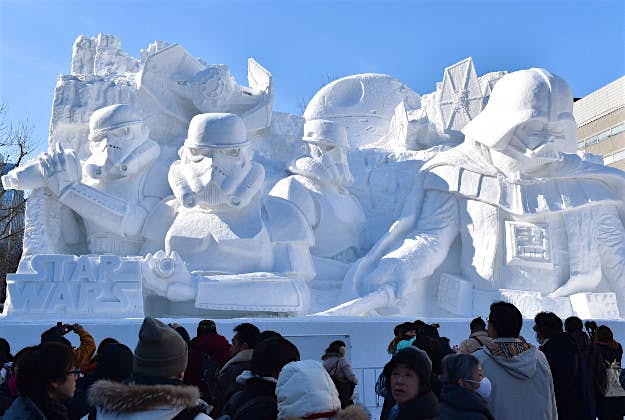 Travel News - Snow FestivalGettyImages-462780006 Visitors gather around a large snow sculpture called the snow 'Star Wars' produced by the Japan Ground Self-Defense Force, Sapporo snow festival cooperation group during the 66th annual Sapporo Snow Festival on February 5, 2015