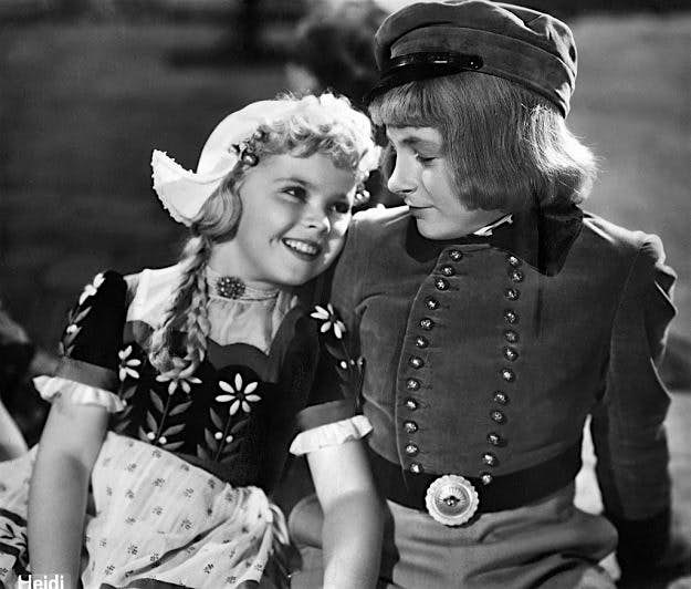Travel News - Temple, Shirley - Actress, Diplomat, USA - *23.04.1928- Scene from the movie 'Heidi'' withh Delmar Watson ass Peter, the Goat General Directed by: Allan Dwan USA 1937 Produced by: Twentieth Century Fox Vintage property of ullstein bild A scene from the 1937 film Heidi. Image: Ullstein Bild via Getty Images