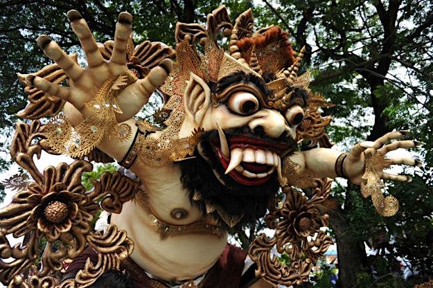Travel News - INDONESIA-RELIGION-FESTIVAL-NYEPI Balinese Hindu prepare an effigy known as "Ogoh-Ogoh" before a parade in Denpasar.