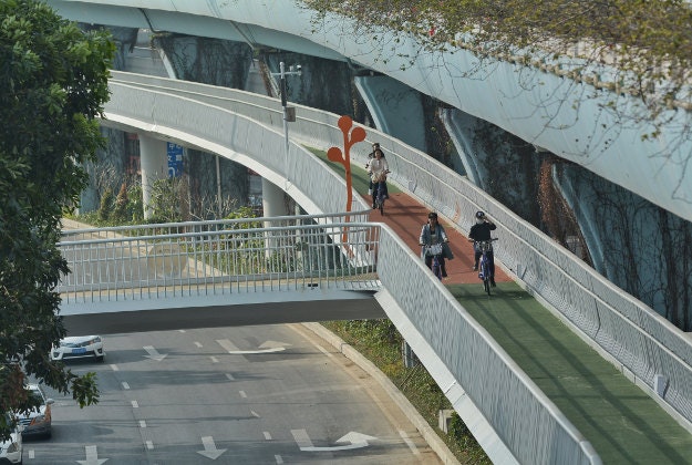 add to cart download Cyclists ride on China's first elevated bicycle track constructed above the ground in Xiamen city, southeast China's Fujian province, 23 January 2017.