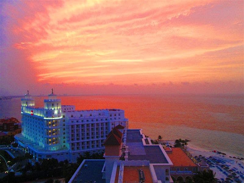 Travel News - Sunset over the Riu Hotel Sunset over the Riu Hotel in Cancun, Mexico. Image: Jessica Bryant/Lonely Planet