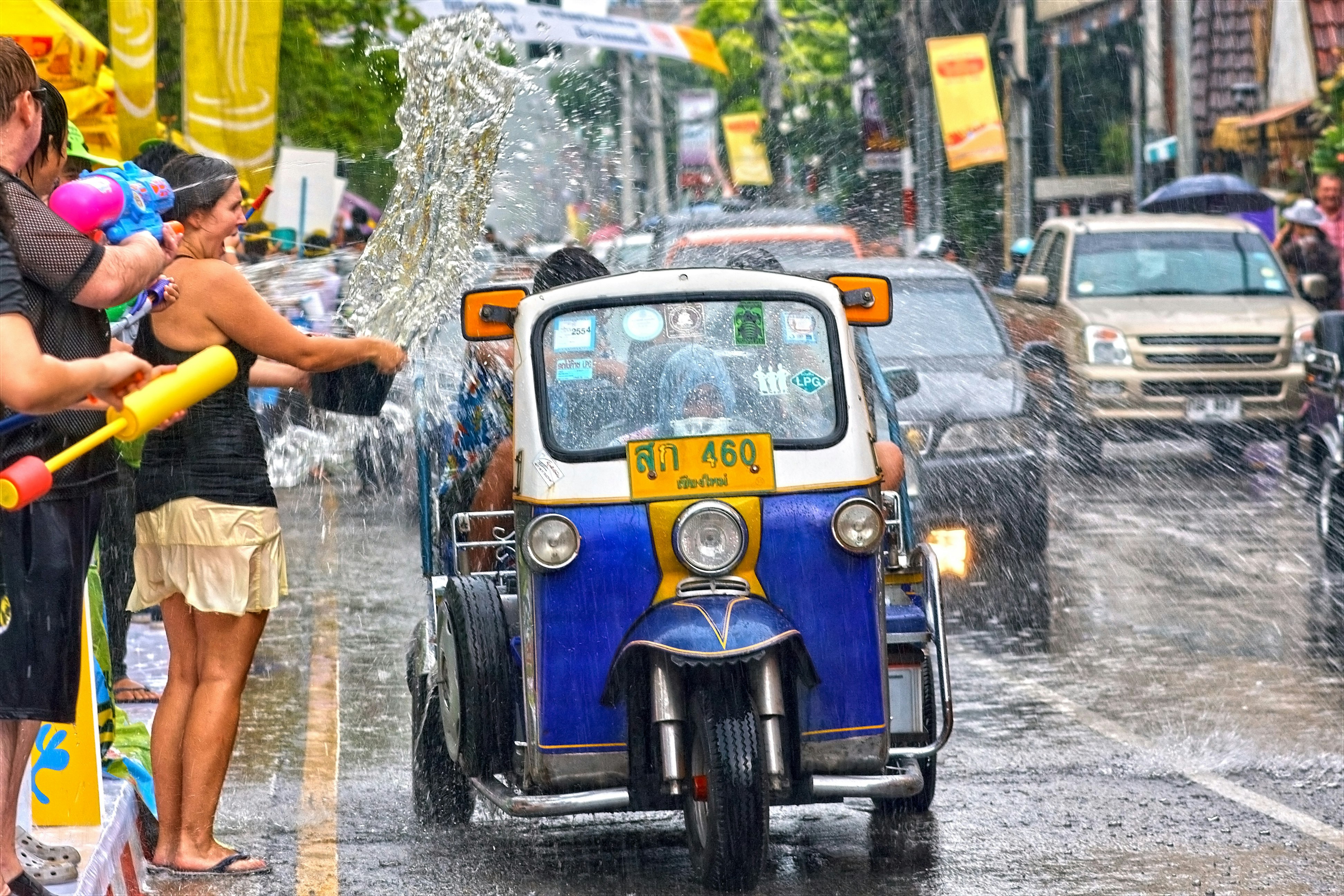 Tuk Tuk being doused with water at Songkran Festival.Chiang Mai, Chiang Mai, Thailand, South-East Asia, Asia