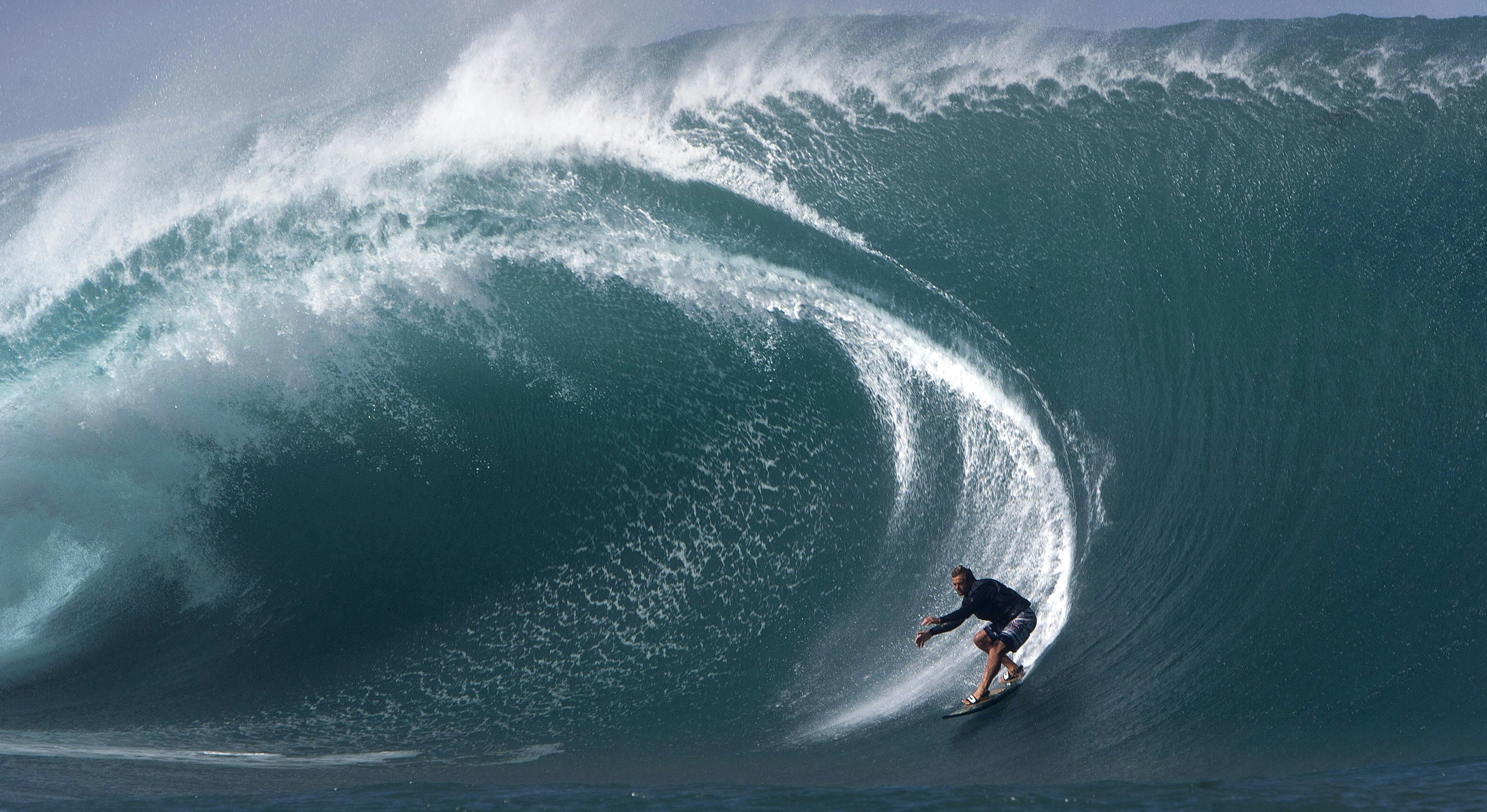 US surfer Laird Hamilton rides a wave at Teahupoo in Tahiti.