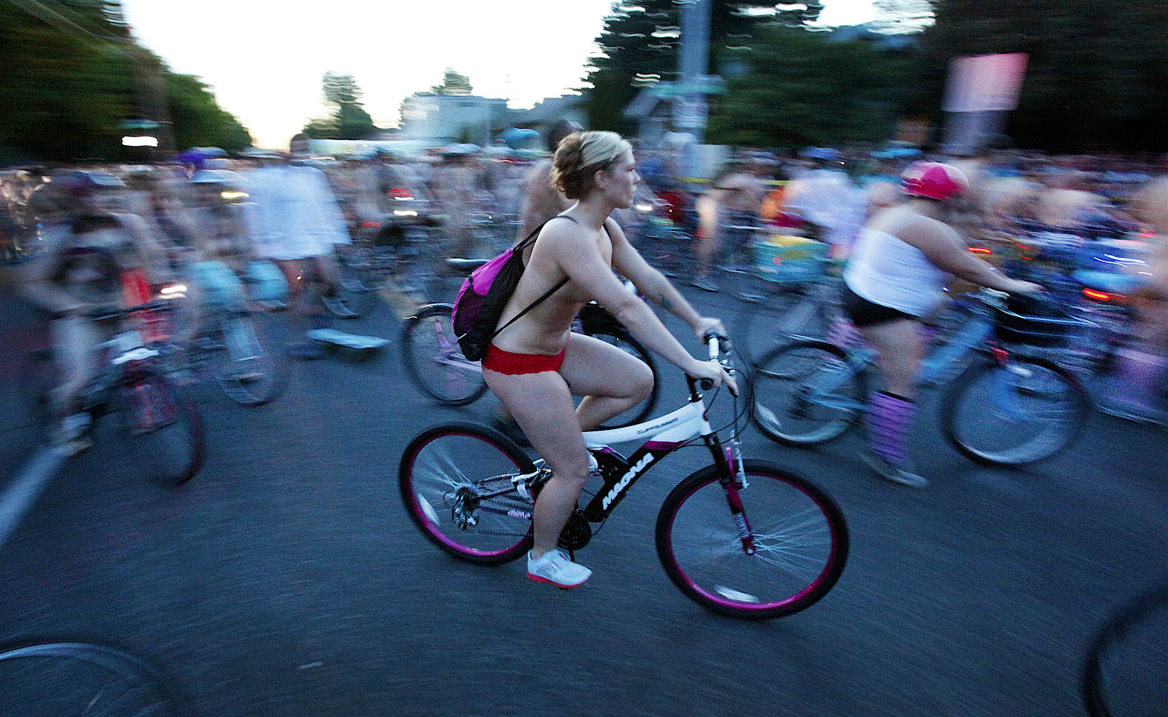 Travel News - PORTLAND, OR JUNE 7, 2014 -- Thousands of bicyclists in varying degrees of undress rolled out of N A group of scantily-clad cyclists in Portland, Oregon.