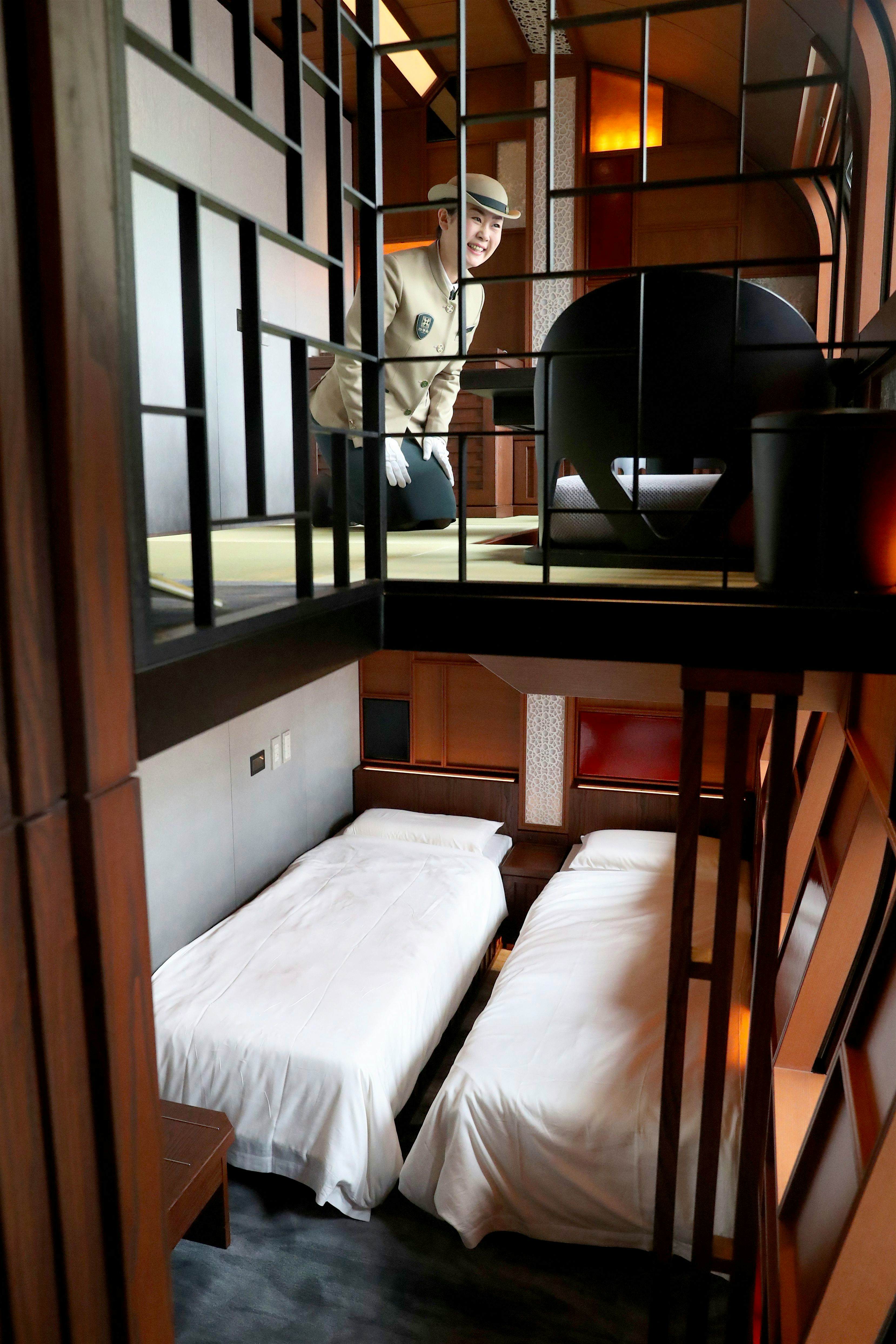 Travel News - JAPAN-TRAIN A crew member introduces the Shiki-Shima Suite of the Train Suite Shiki-Shima.