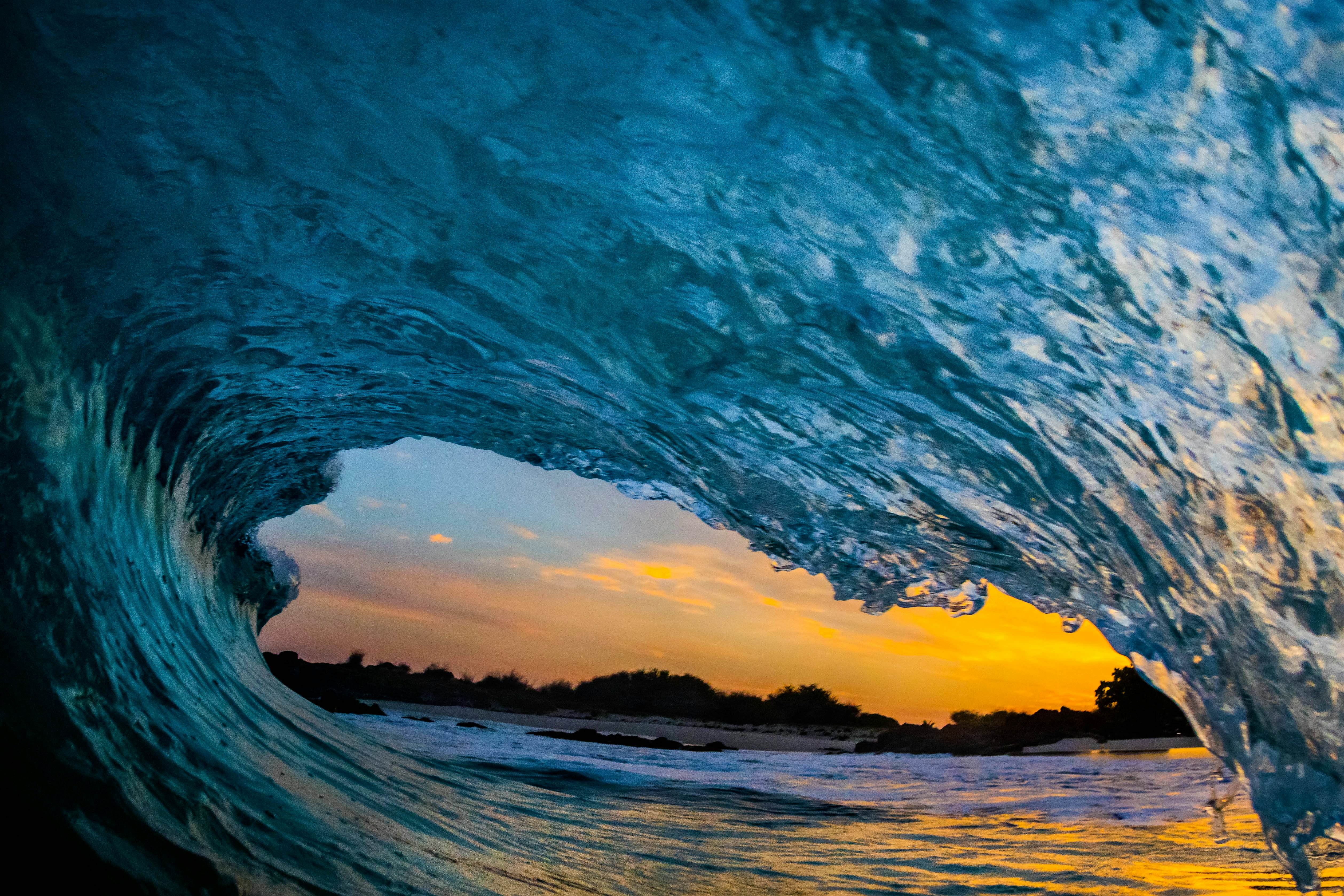 Travel News - Anatomy of a Wave HAWAII, USA: INCREDIBLE images have revealed the anatomy of a wave after one brave photographer risked life and limb to slip under the waves and capture them from behind as they broke. The stunning underwater shots show violent vortices venting from the collapsing tube of a breaking wave, and the backside of a breaking wave, which can either look like a mirror or act as a window when the wave is very thin. Other amazing pictures show the more traditional view of a breaking wave as the camera points down the tube while surfers and swimmers are pictured trying to ride or avoid the waves. The spectacular snaps were taken at Kua Bay, Hawaii by author and photographer Don Hurzeler (70), from Kailua-Kona, Hawaii, who explained just how dangerous this type of photography can be.