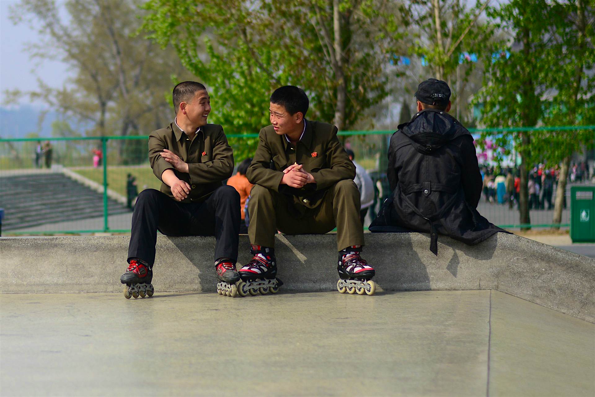 Travel News - Inside North Korea North Korean teenagers chat at a skate park.