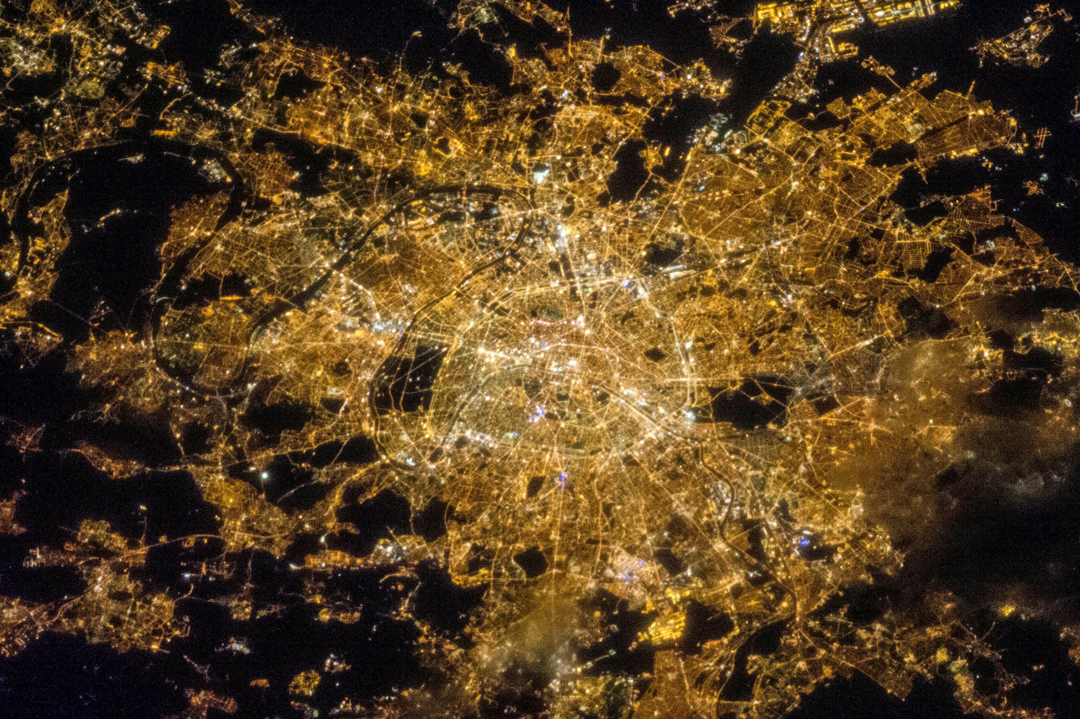 Travel News - Megacity Blue The City of Light illuminates the night sky in one stunning snap as Paris spreads far and wide