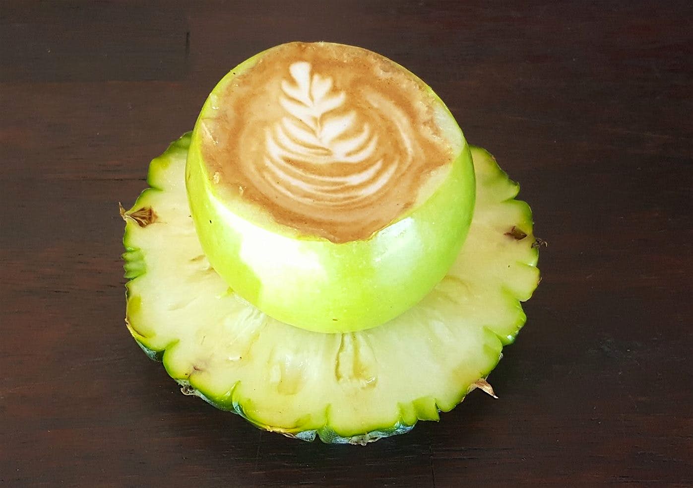 Travel News - 16487822_1790052434650170_5928731699464443225_o You can enjoy coffee served in an apple on a saucer of pineapple at the Locals Corner cafe in Australia.