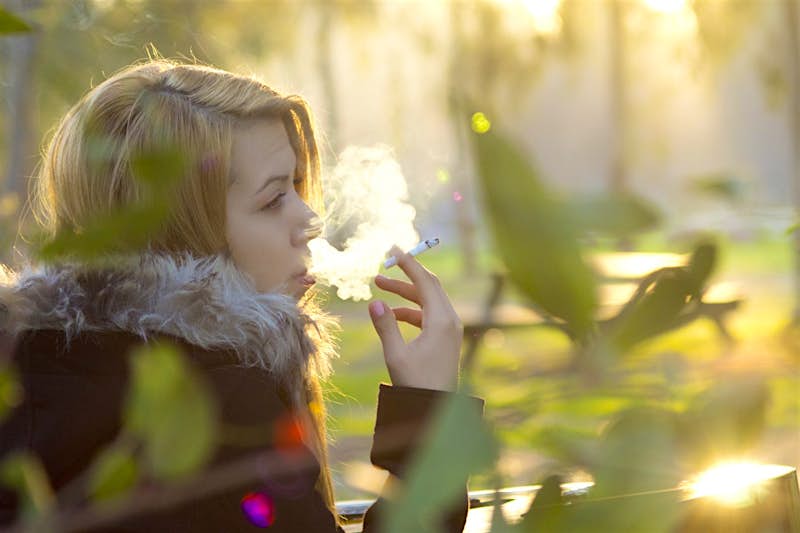 A young woman smoking 