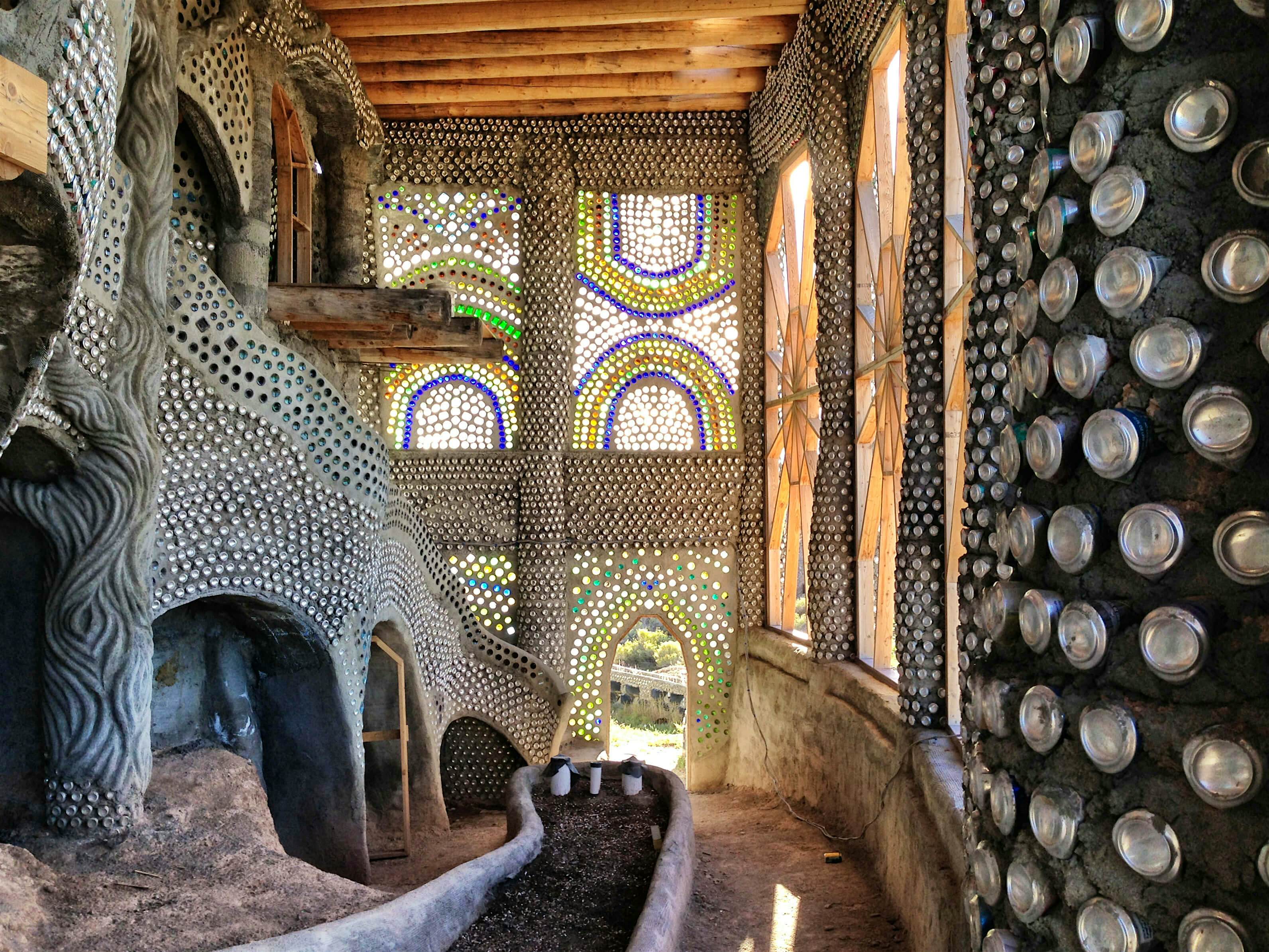 Travel News - MDRUM_Disaster_Homes-9 (1) Inside the Eve Earthship which has a wall built from tyres.