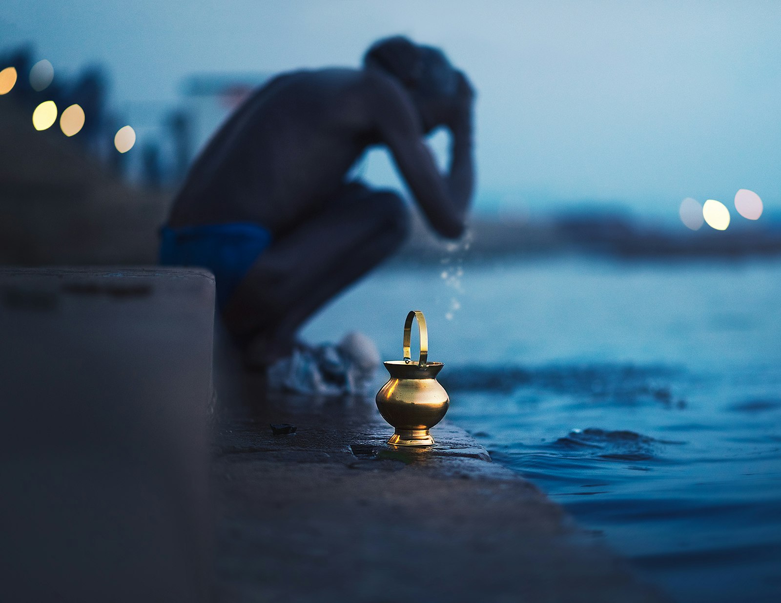 Bathing at the edge of the river Ganges in Varanasi