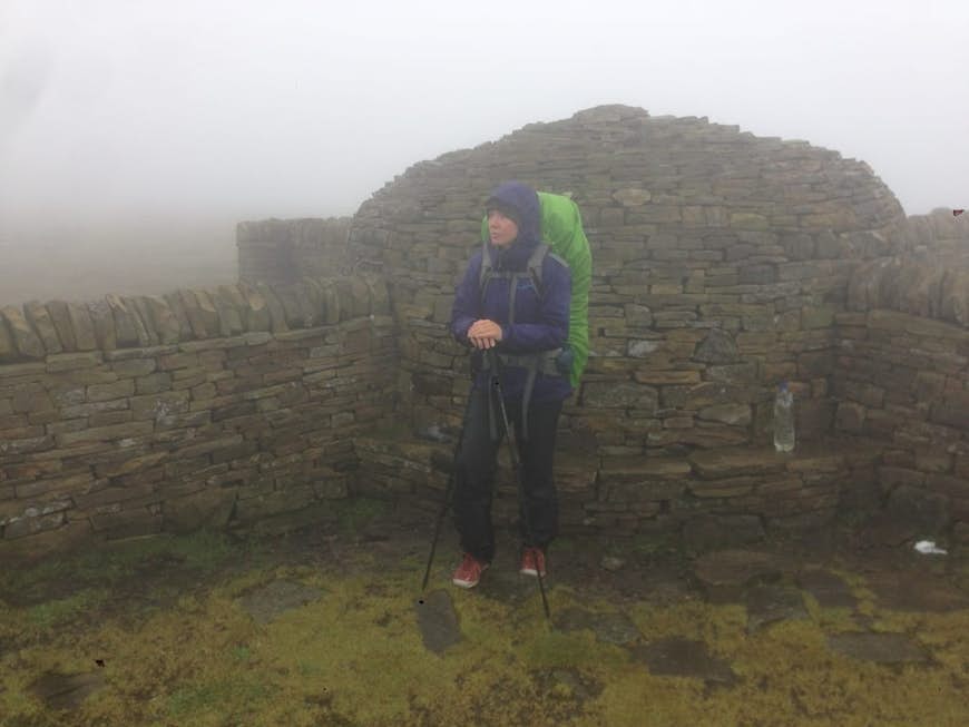 Angela hiking from Scotland to England.