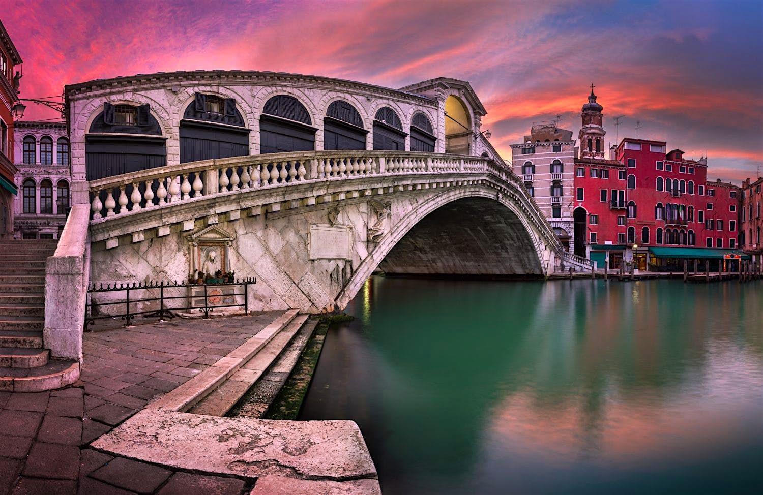 Travel News - Panorama of Rialto Bridge and San Bartolomeo Church at Sunrise, Venice, Italy Panorama of Rialto Bridge and San Bartolomeo Church in Venice, Italy. Image: Anshar/Shutterstock