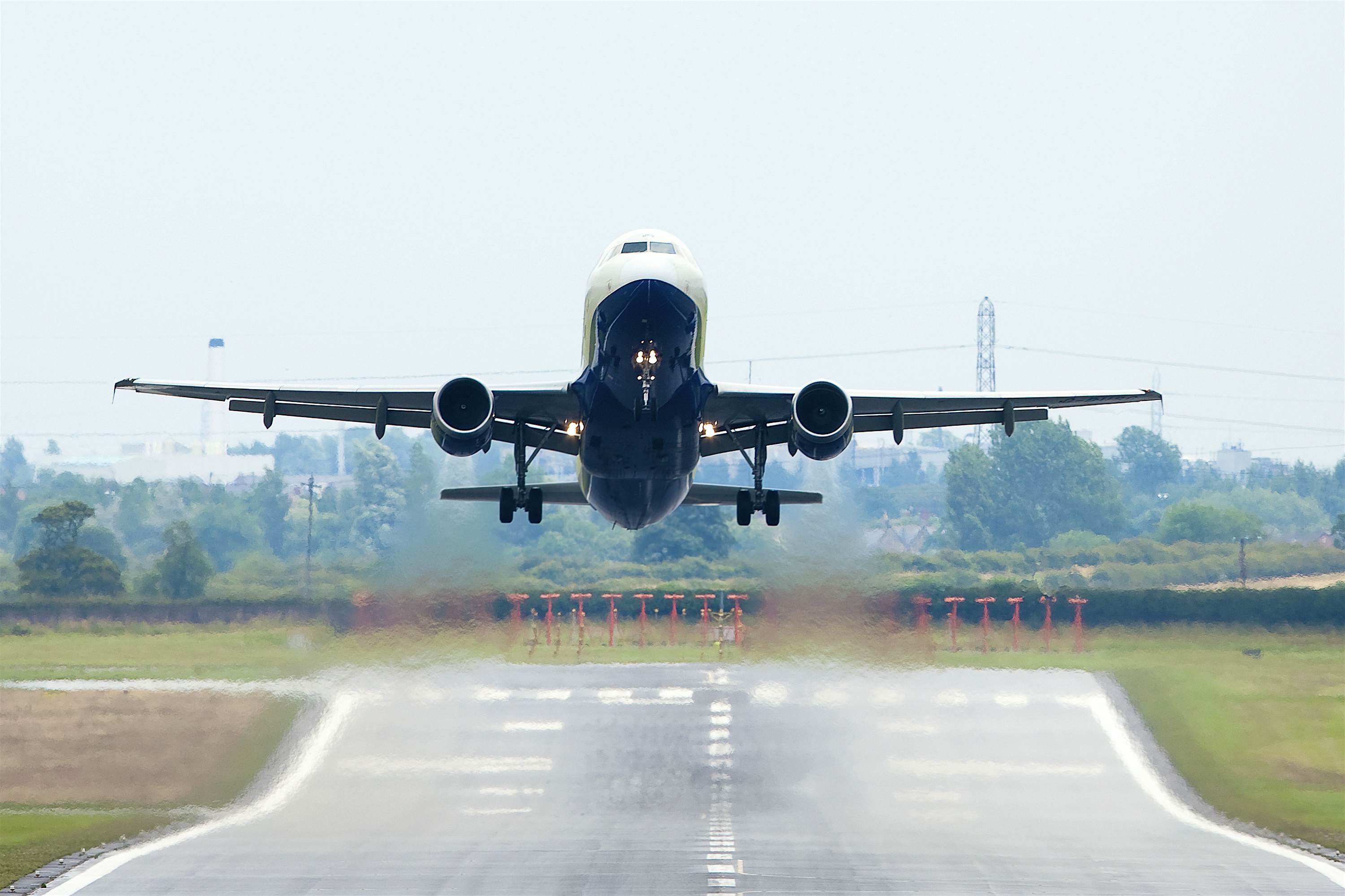 Travel News - Departing Flight Jet departing in the heat.