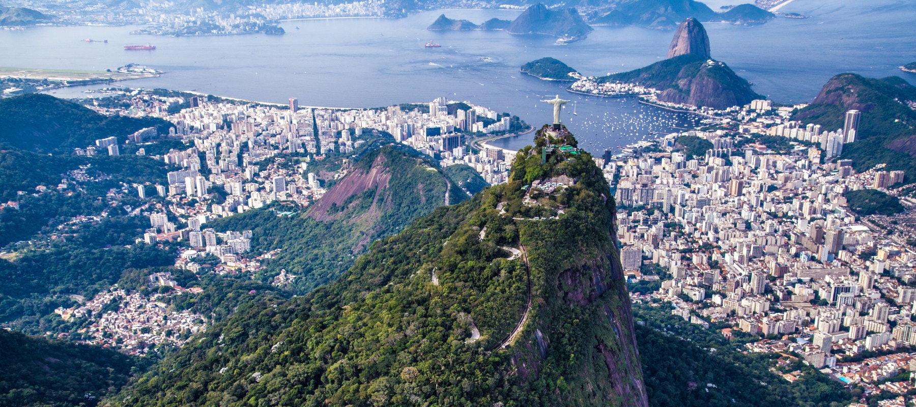 Aerial view of Christ the Redeemer overlooking Sugarloaf and Rio de Janeiro. 