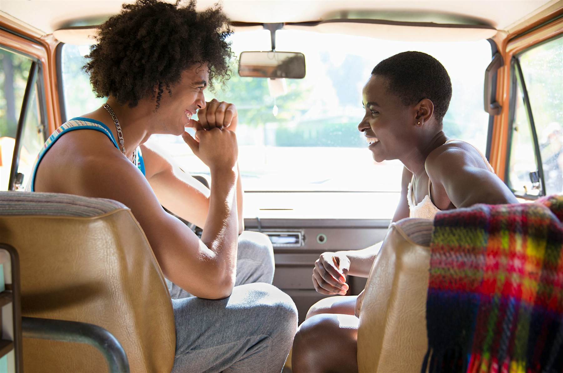 Travel News - romantic roadtrip find intersections Couple relaxing in camper van