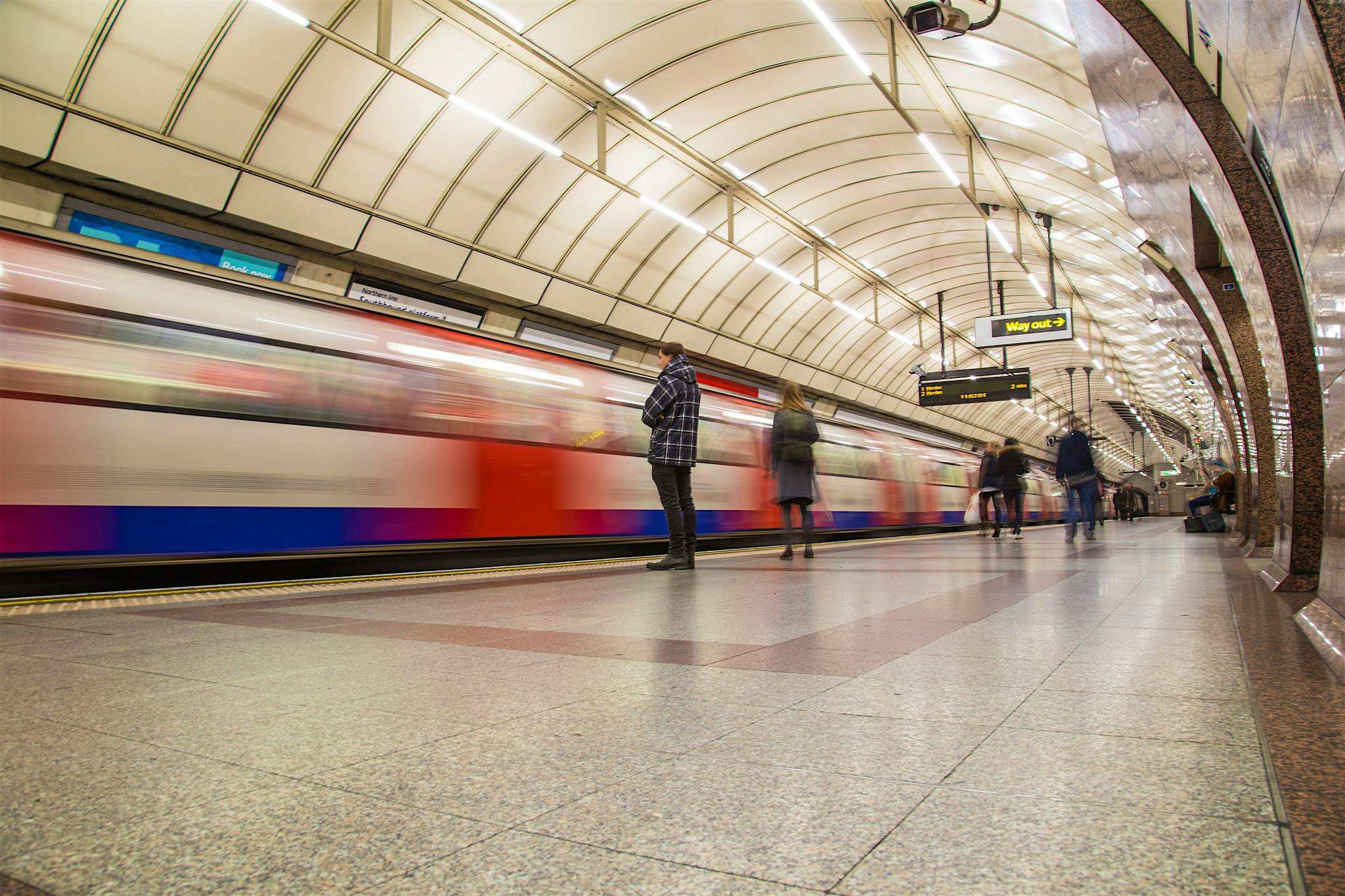 Travel News - London Underground train going past a train goes past a London underground station
