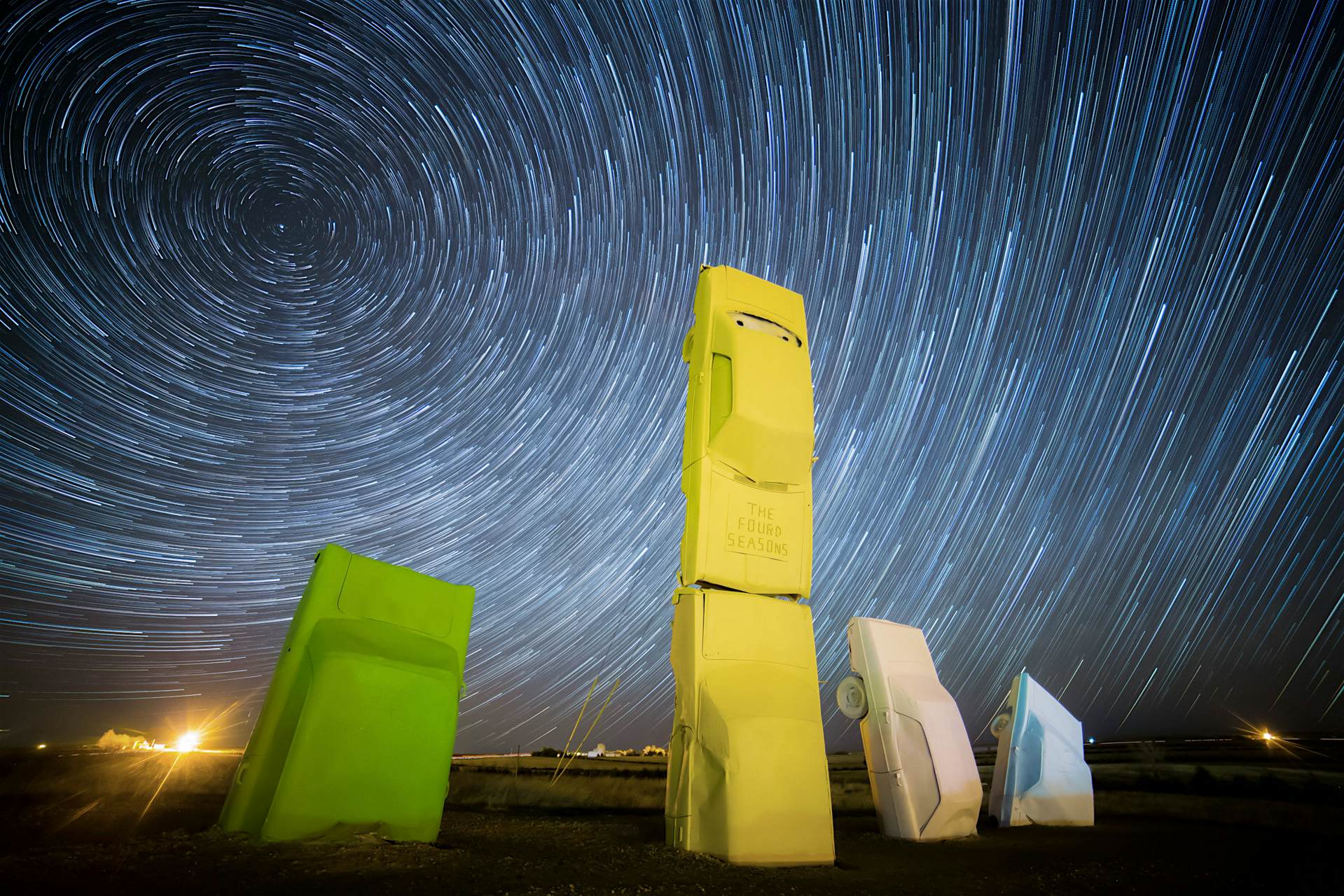 Travel News - eclipse carhenge usa stormhenges-16 Colourful cars at carhenge with stars overhead in Nebrasaka