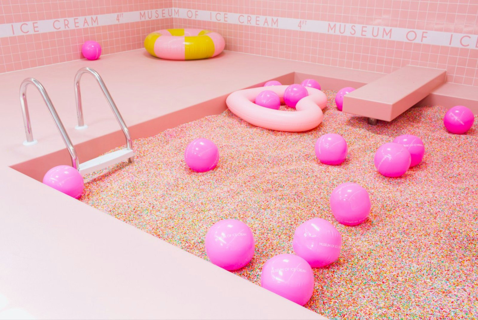 A bright pink Sprinkle Pool at the Museum of Ice Cream.