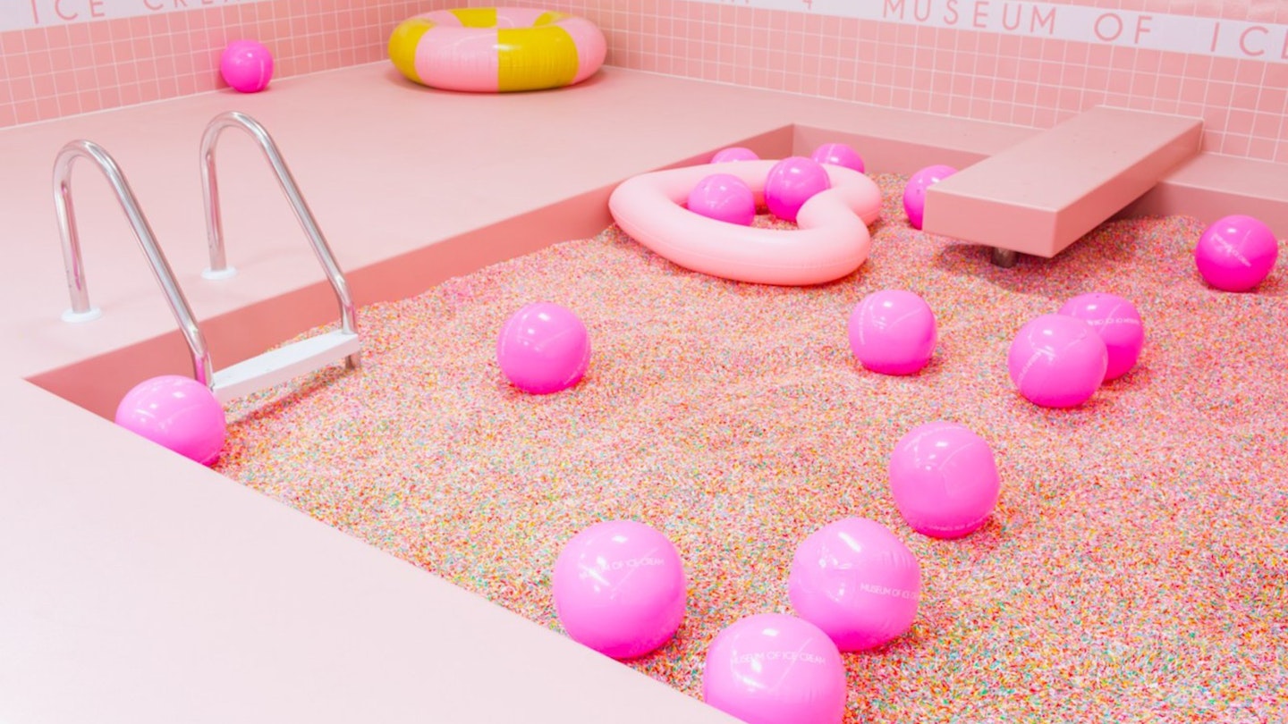 A bright pink Sprinkle Pool at the Museum of Ice Cream.