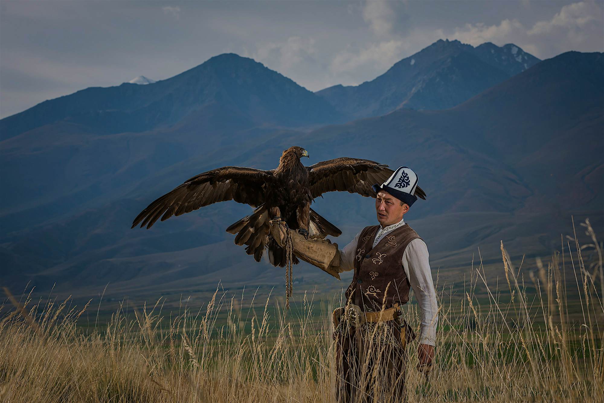 Travel News - A hunter and bird are paired together for as long as 20 years. Photo by Manish Lakhani Hunter and eagle in Kazakhstan