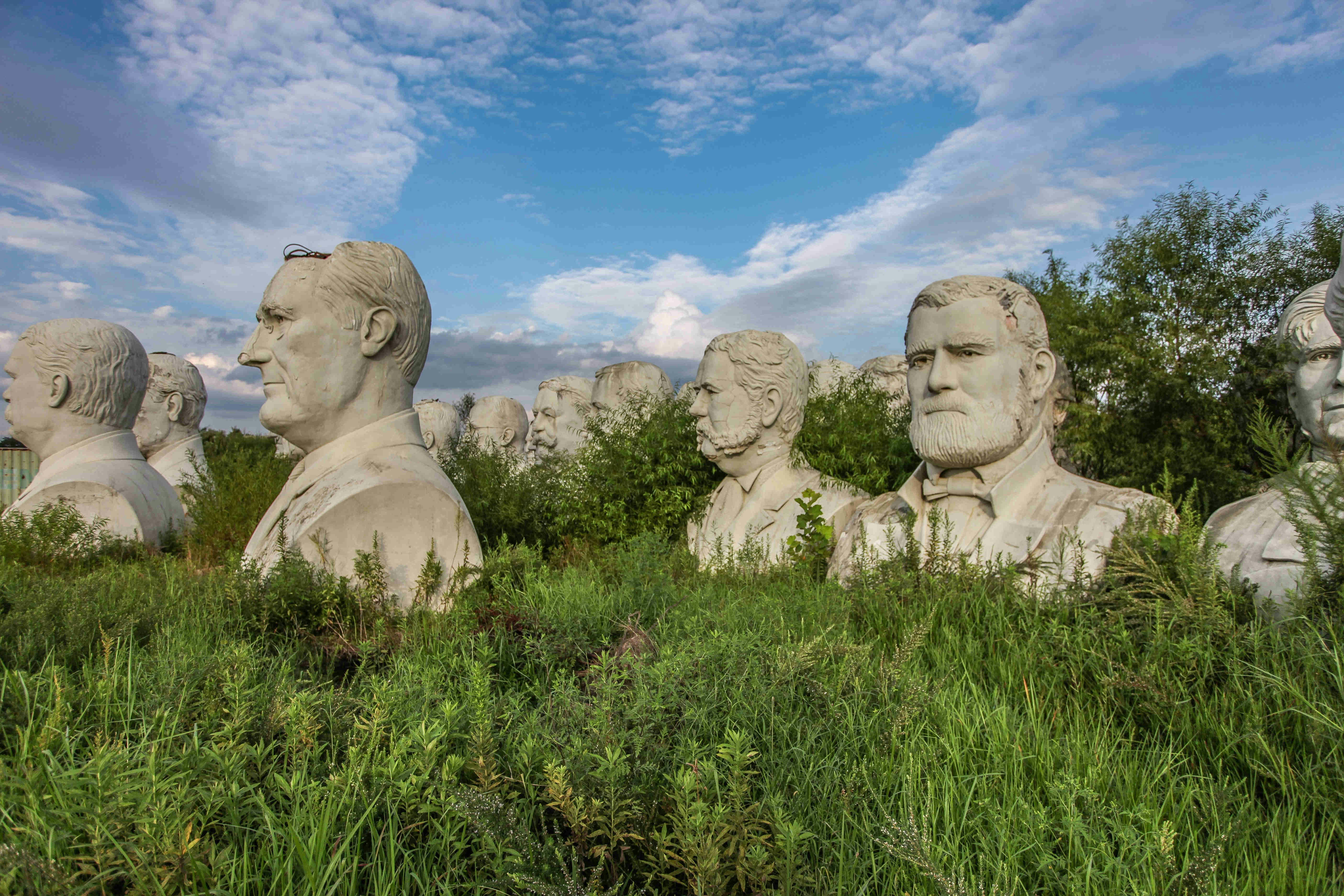 43 heads of US American Presidents stand abandoned in a field in