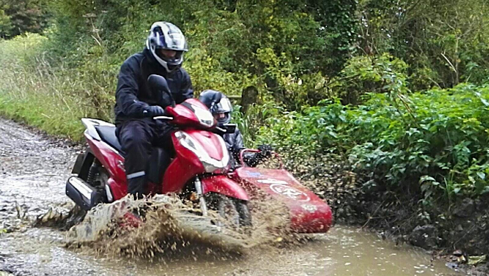 Travel News - Matt and Reece in training for their epic adventure. Photo courtesy of Flight Centre UK London travel consultants to travel the world on a scooter and sidecar
