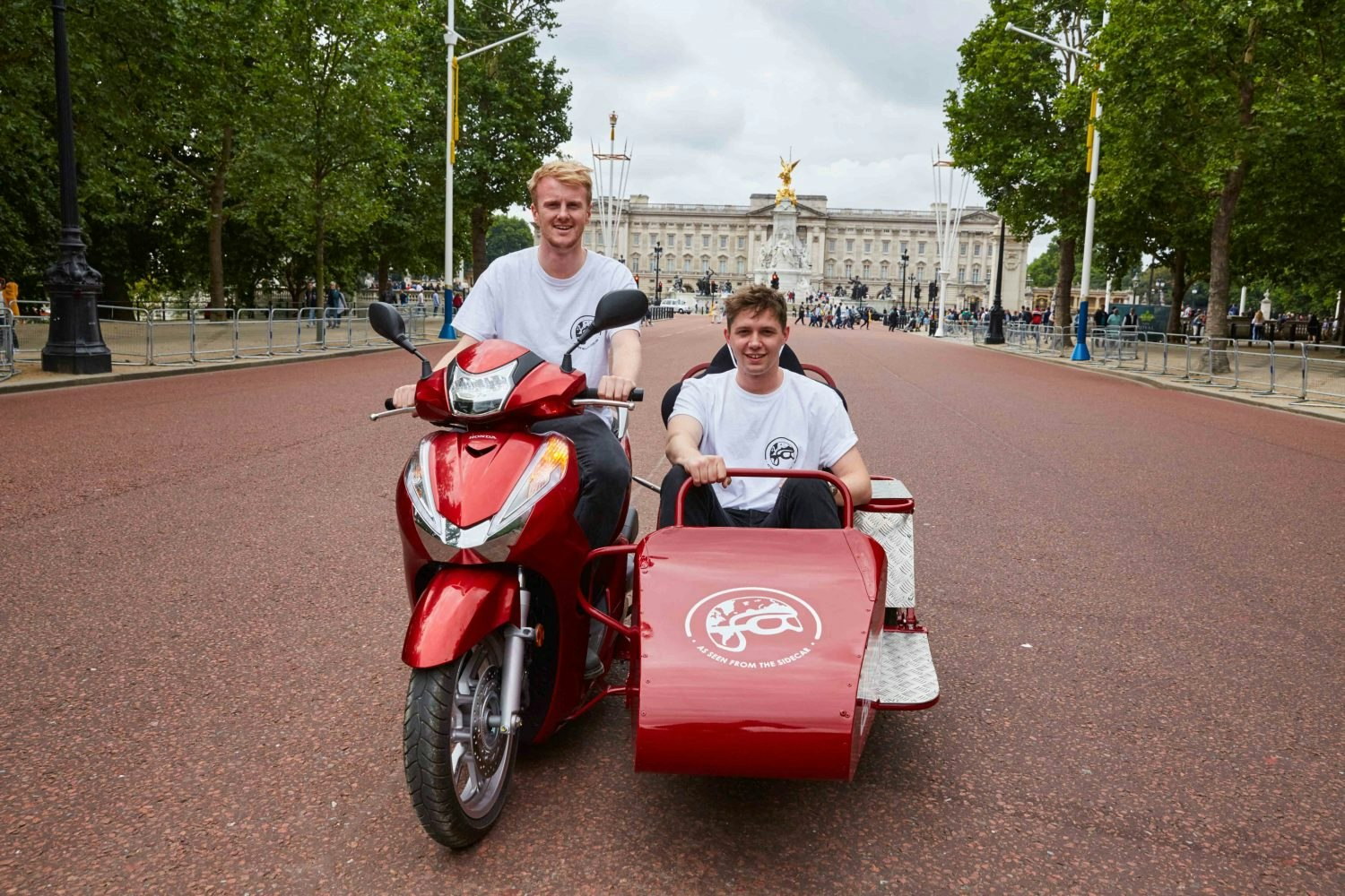 Travel consultants plan round the world trip on a scooter