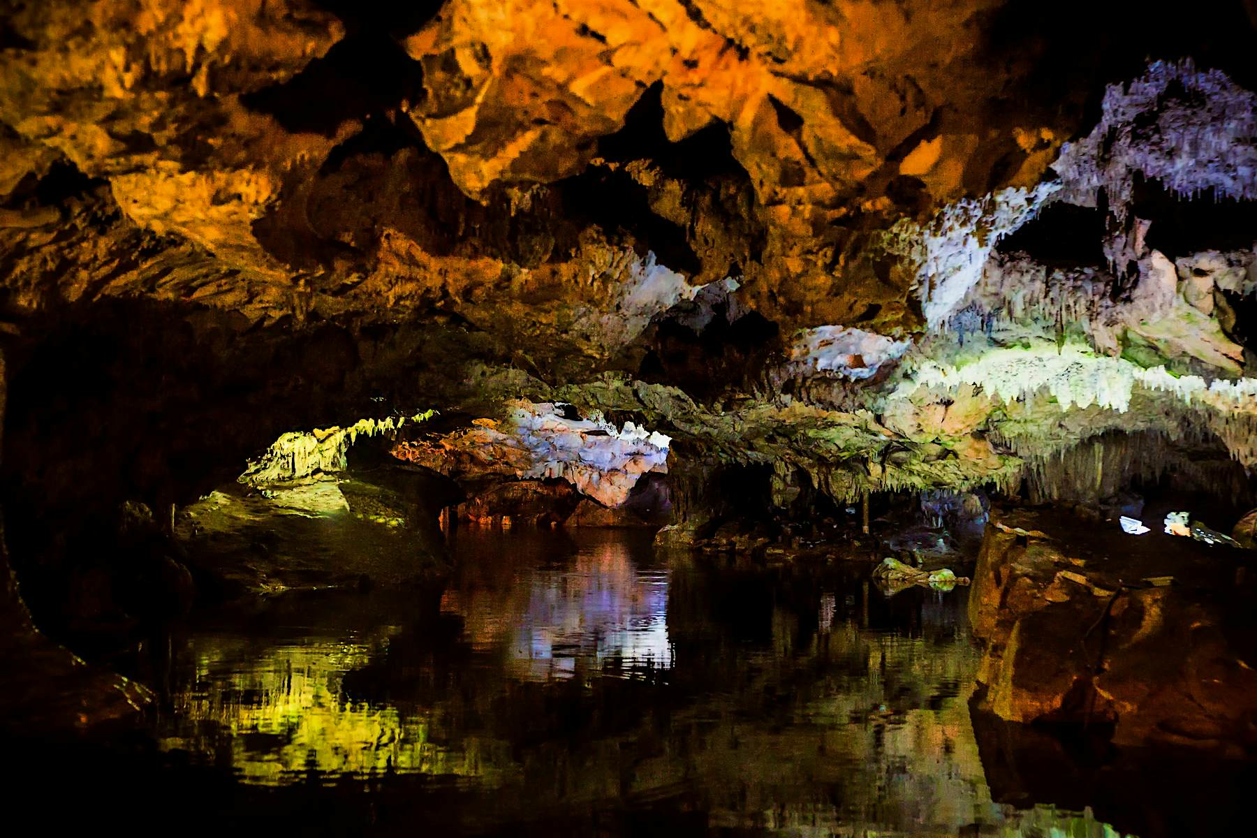 Travel News - The caves are filled with water, so visitors pass through in boats Image courtesy of Yannis Larios Photographer captures the natural beauty of Diros Caves