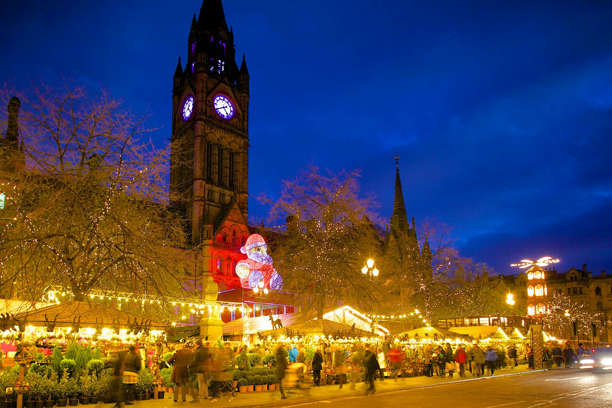 Travel News - Christmas Market and Town Hall, Albert Square, Manchester, England, United Kingdom, Europe Travel News - Christmas Market and Town Hall, Albert Square, Manchester, England, United Kingdom, Europe