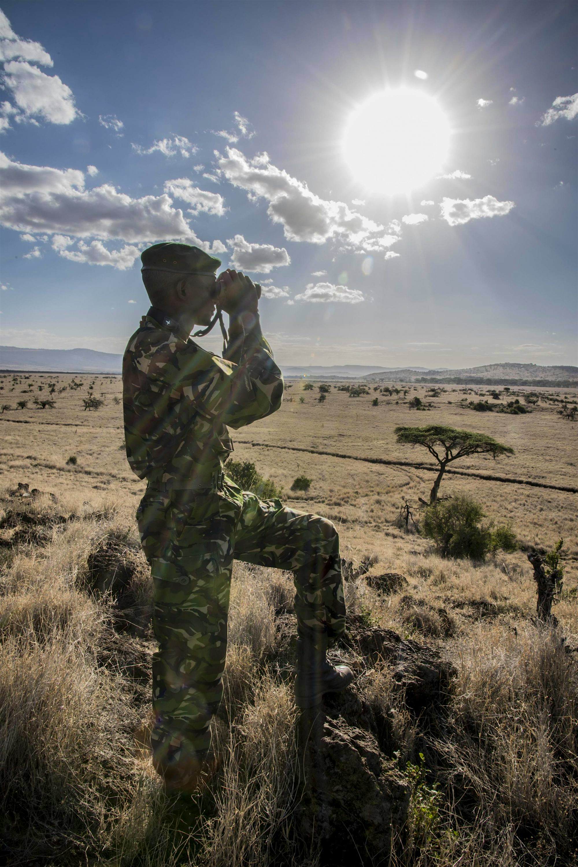 Travel News - Secuity ranger with binoculars- photo by Frank Af Petersen Travel News - Secuity ranger with binoculars- photo by Frank Af Petersen