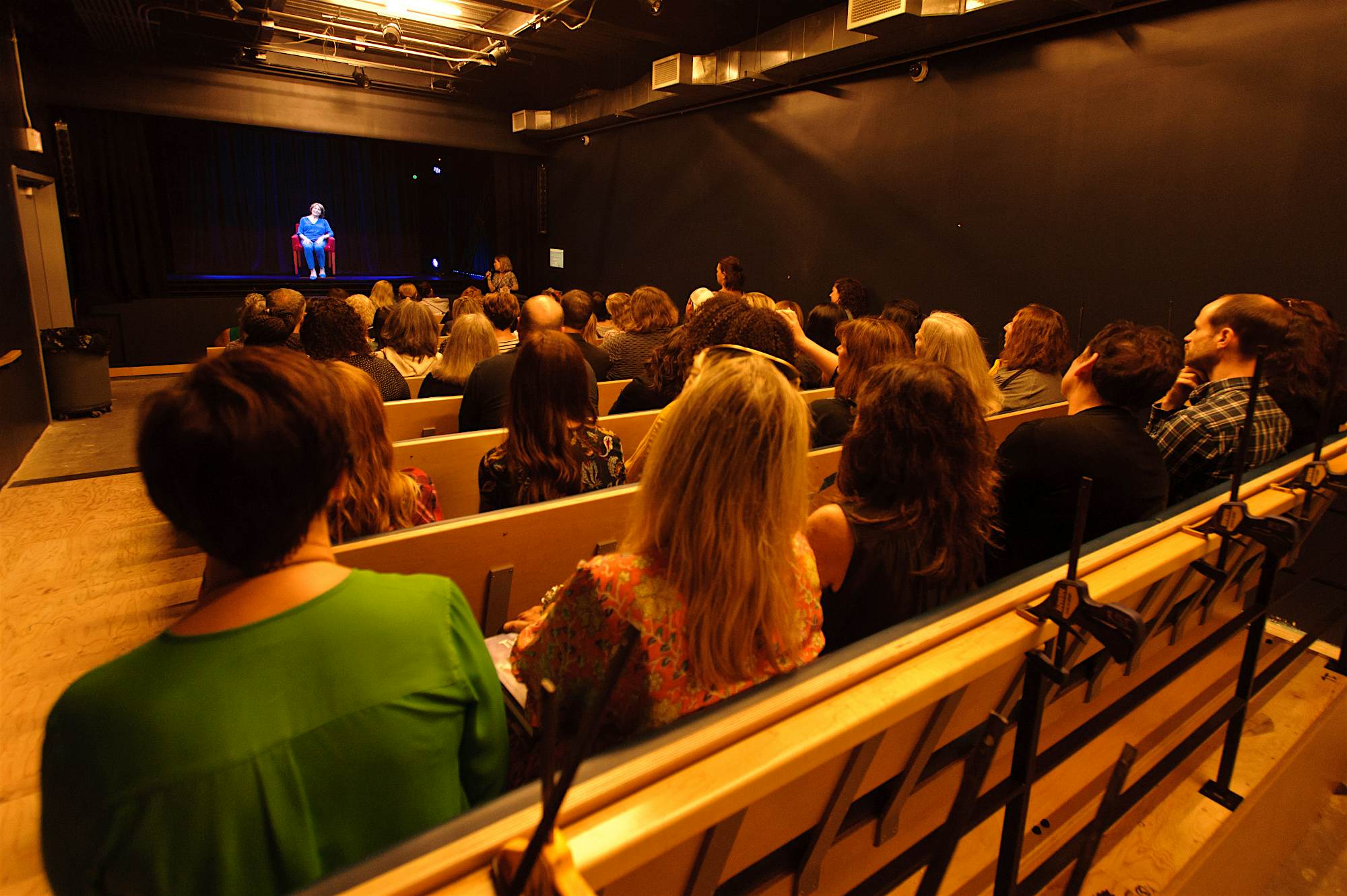 Travel News - Fritzie hologram on stage-open house2 The hologram of survivor Fritzie Fritzshall on stage.