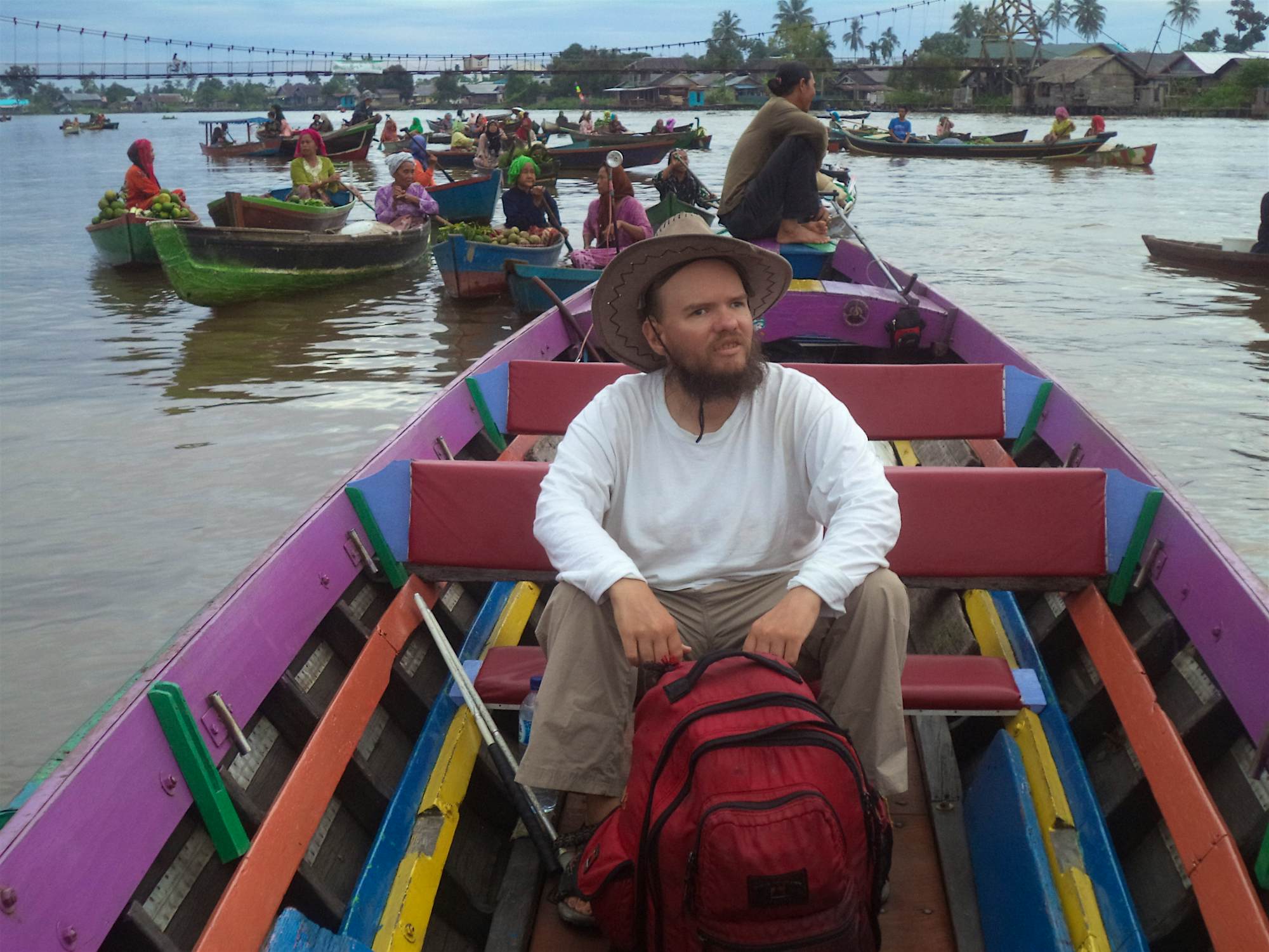 Travel News - Tony in a small local boat, floating market in Banjarmasin, capital of South Kalimantan, Indonesia Tony at the floating market in Banjarmasin in South Kalimantan, Indonesia.