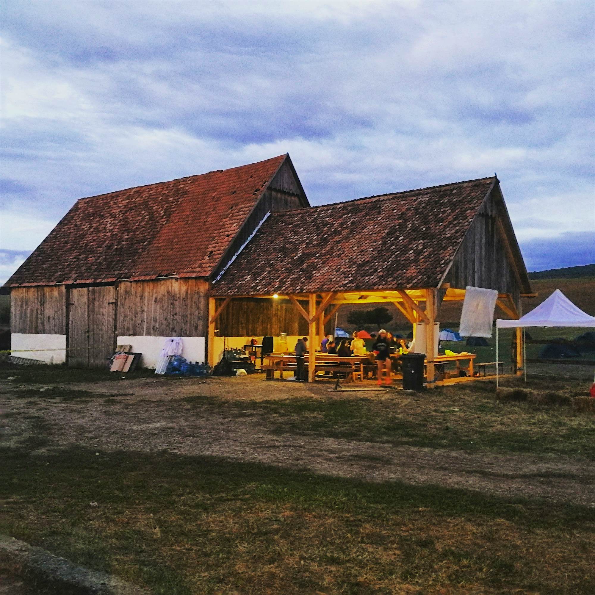 Travel News - Guests dine al fresco at Ferma Indianului. Photo by Krishan George Dinner outdoors at the farm