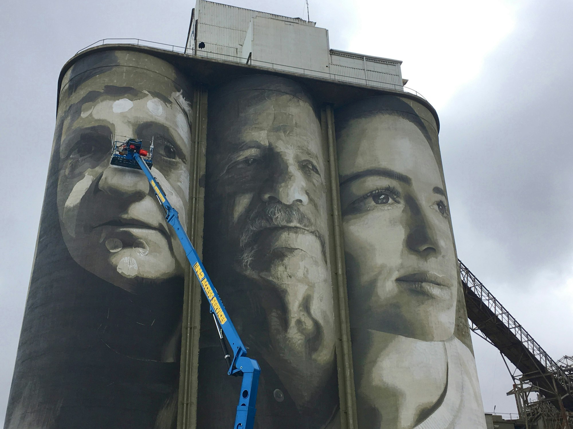 Street artist Rone working on the silo in Geelong