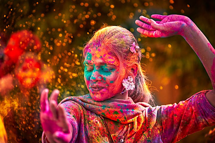 Travel News - Portrait Of Indian Woman With Colored Face Dancing During Holi Portrait Of Indian Woman With Colored Face Dancing During Holi