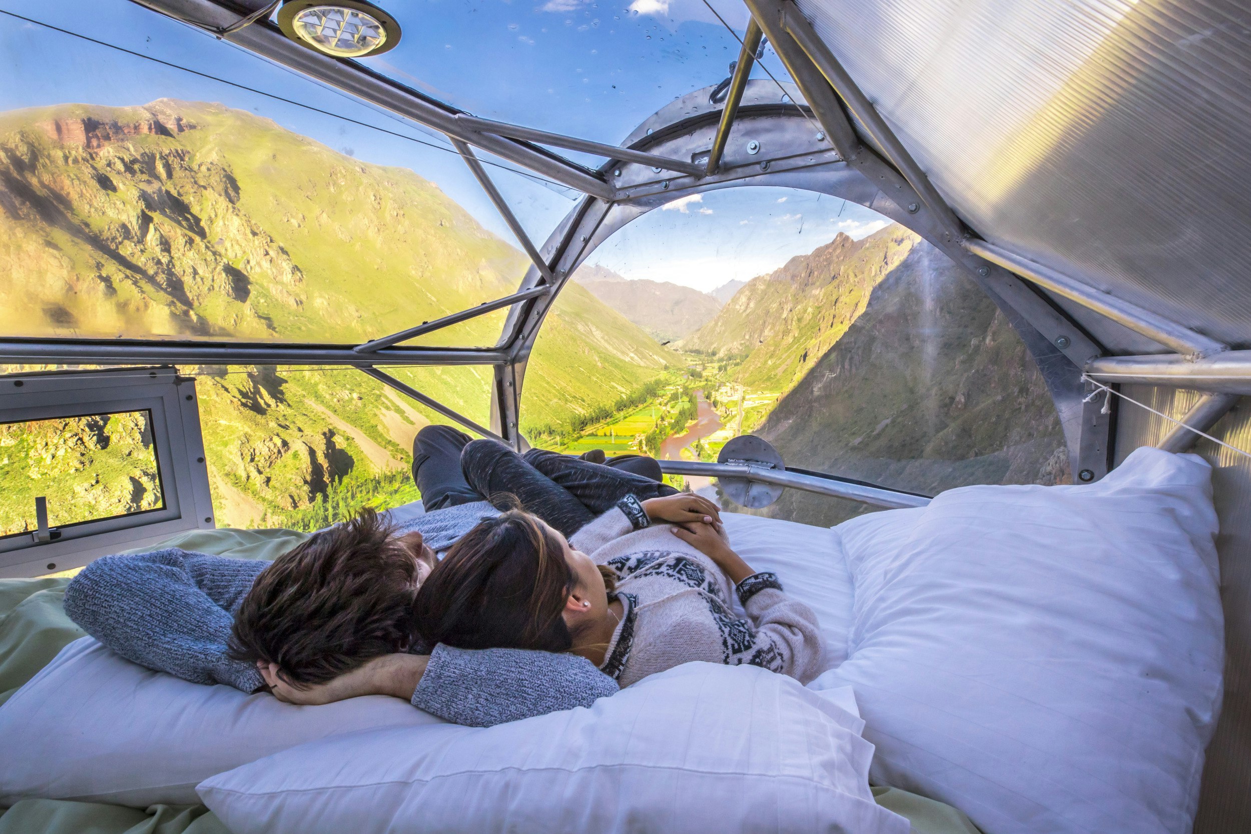 Guests can sleep beneath the stars, perched on the side of a cliff in the Sacred Valley of Peru.