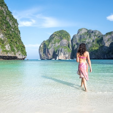 Travel News - Adult woman in bikini on tropical beach, Thailand