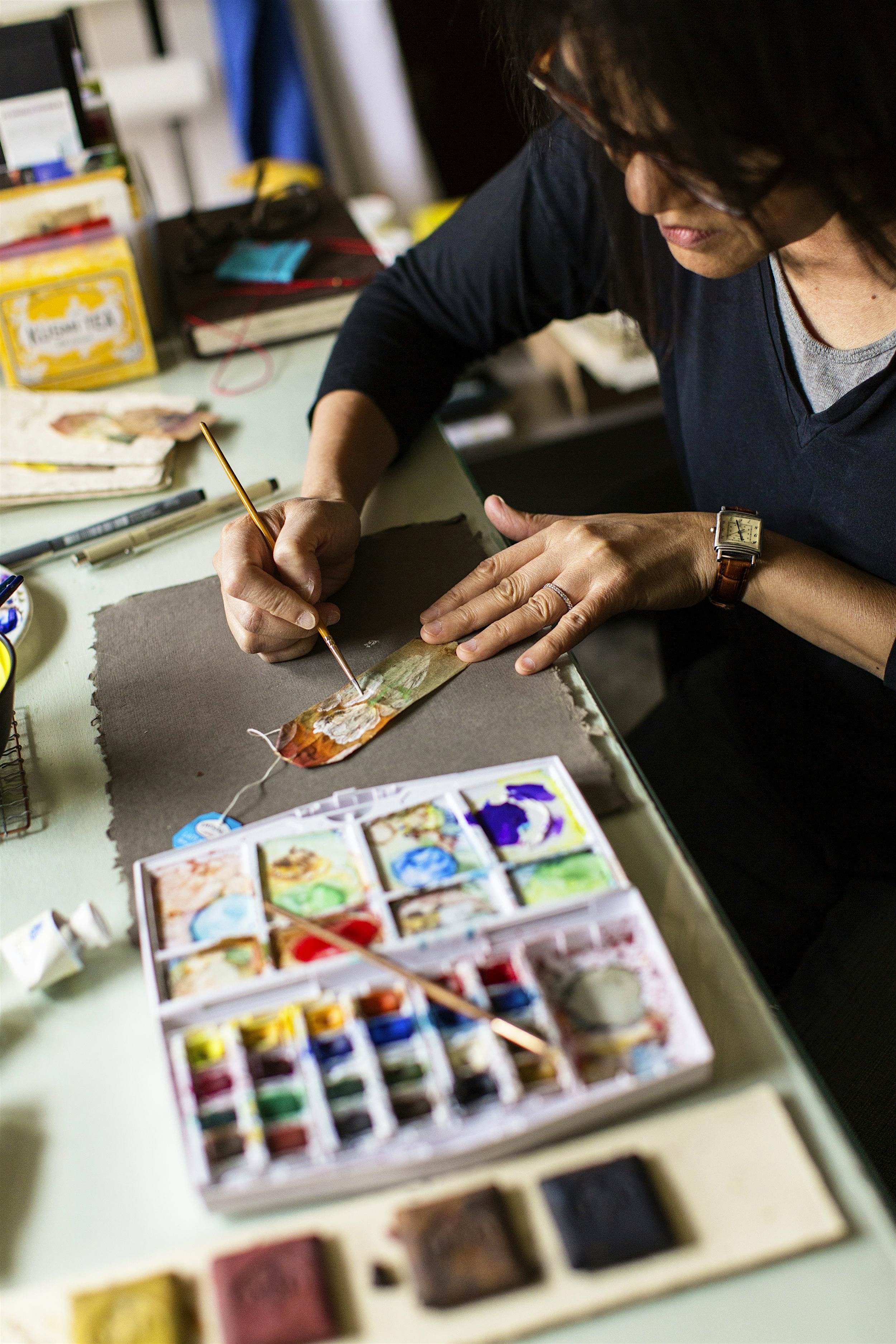 Travel News - Artist at work teabag Teabag art