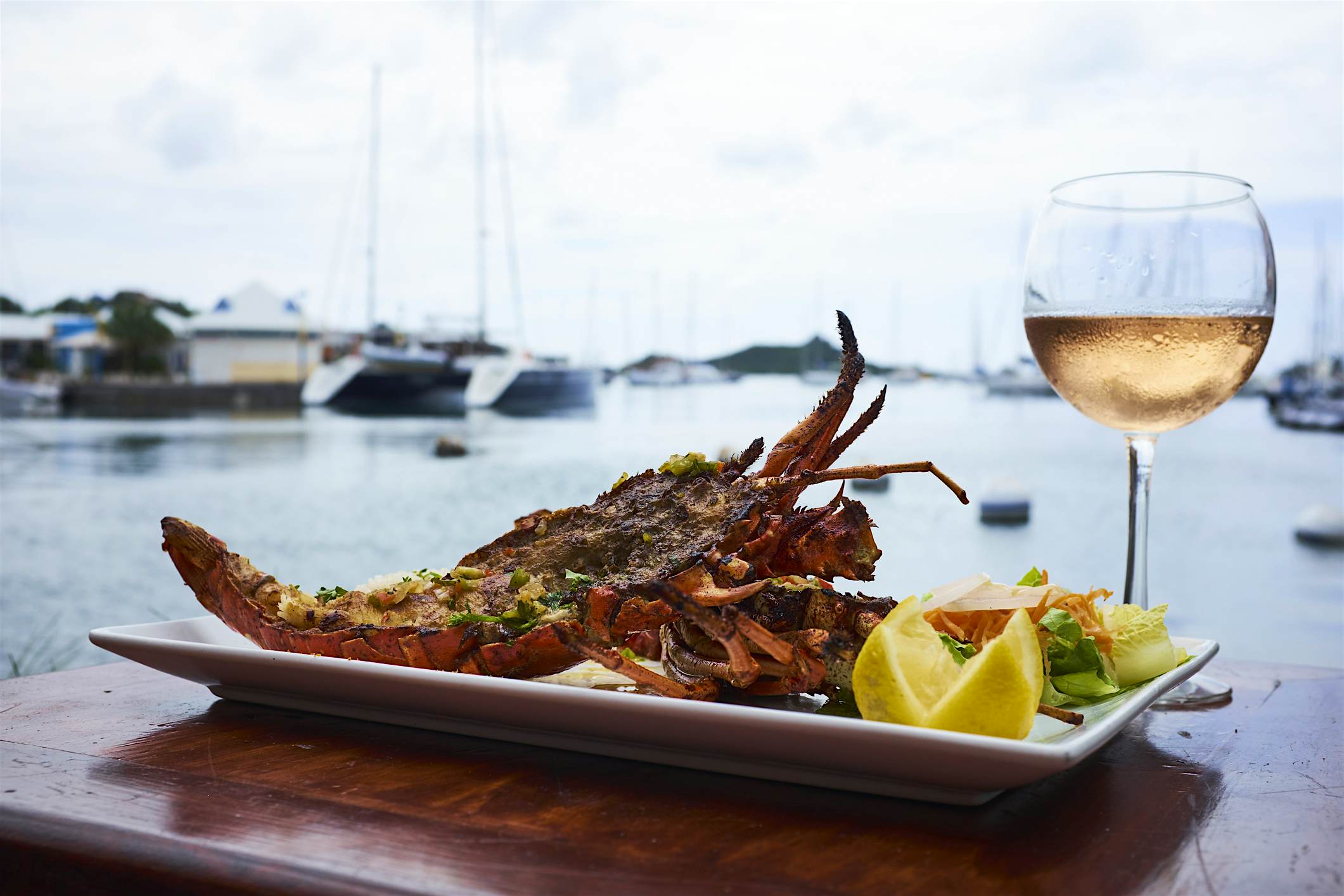 Travel News - Light seafood dish, glass of rose wine Travel News - Light seafood dish, glass of rose wine