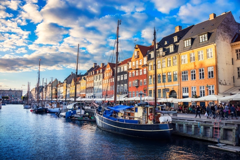 Travel News - Colorful Traditional Houses in Copenhagen old Town Nyhavn at Sunset