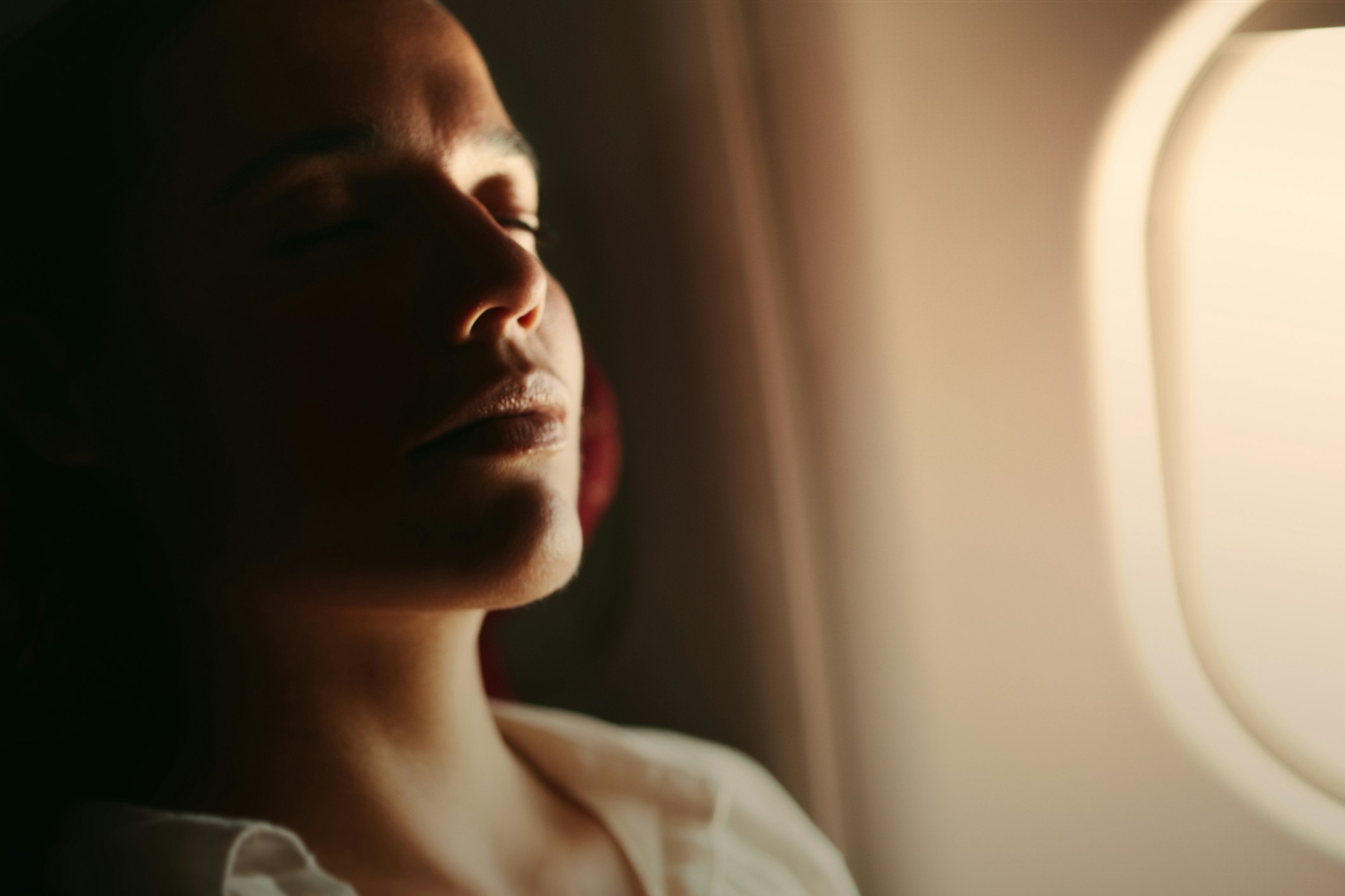 Travel News - Woman enjoying the flight