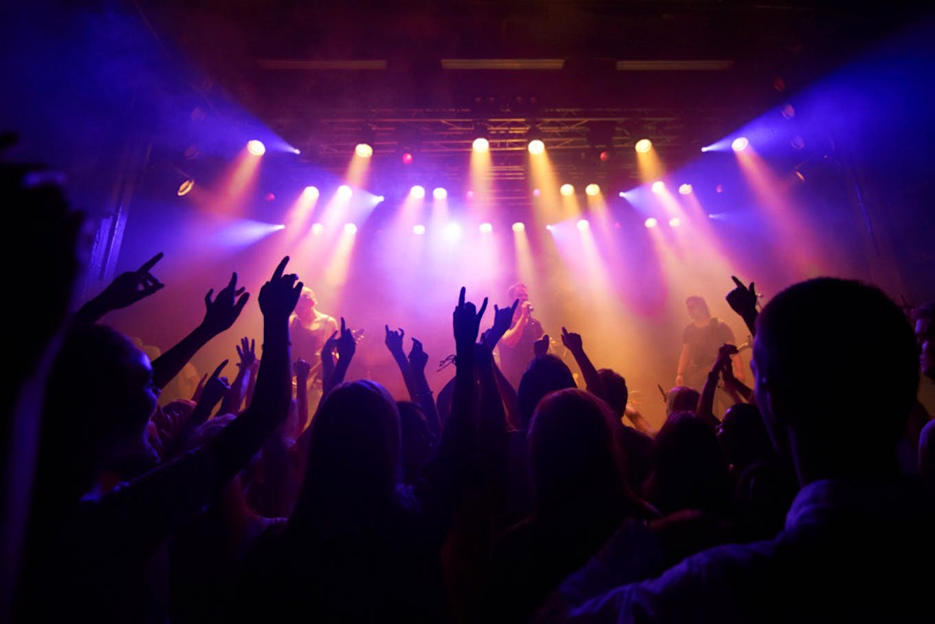 Travel News - Shot of a large crowd at a music concert Travel News - Shot of a large crowd at a music concert
