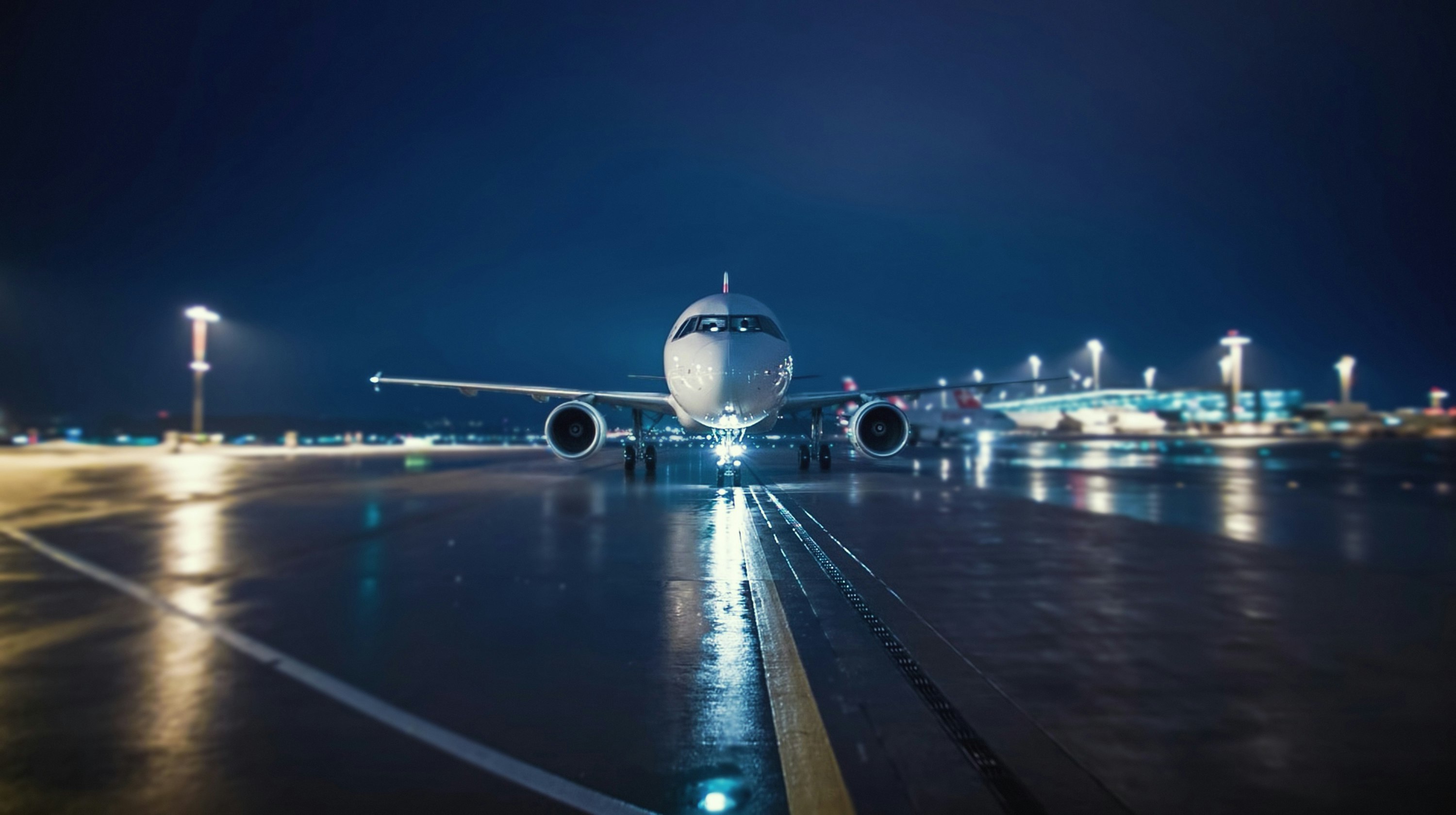 Travel News - Airplane Moving On Runway Against Sky At Night