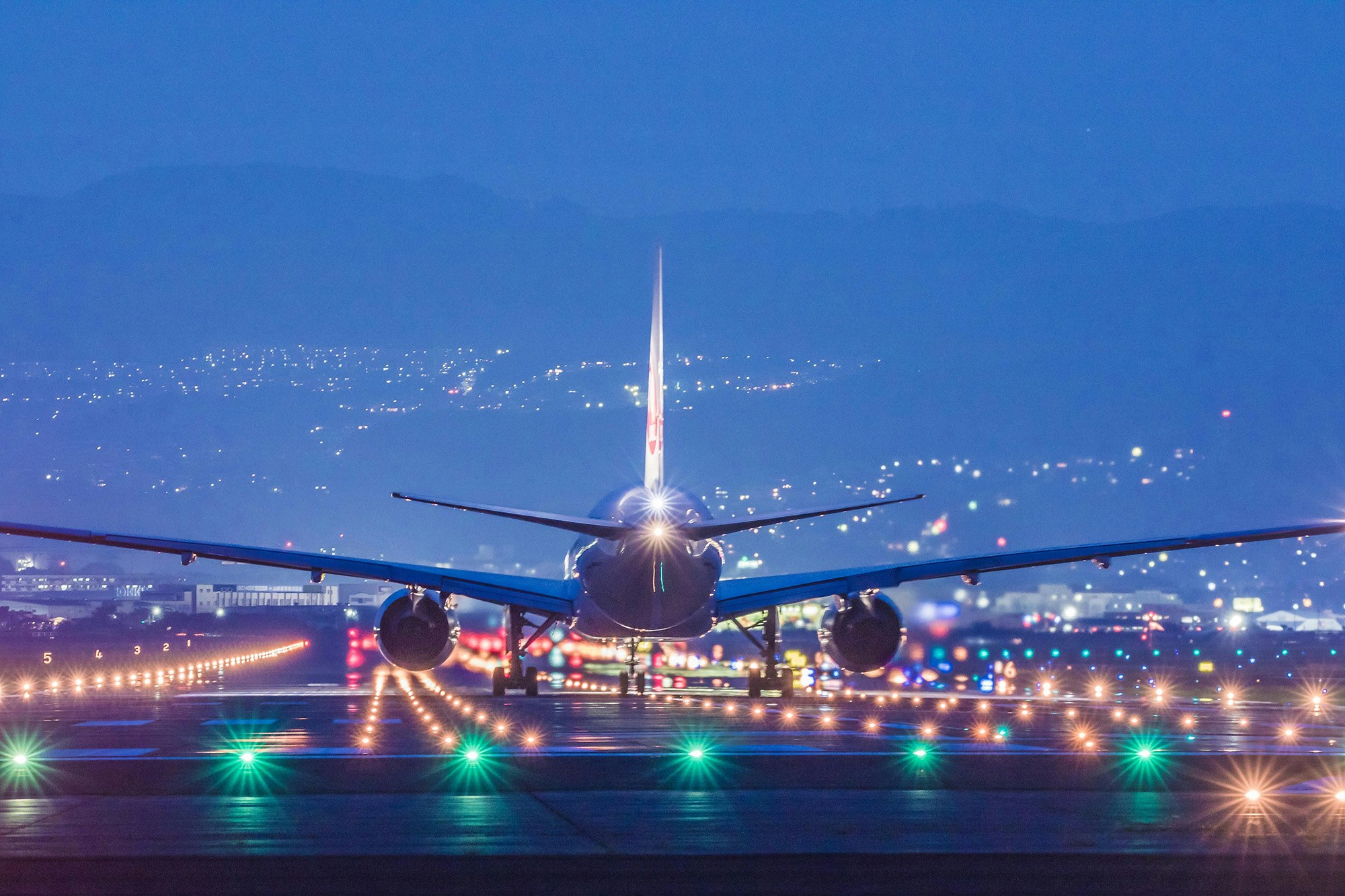 Plane on runway at night