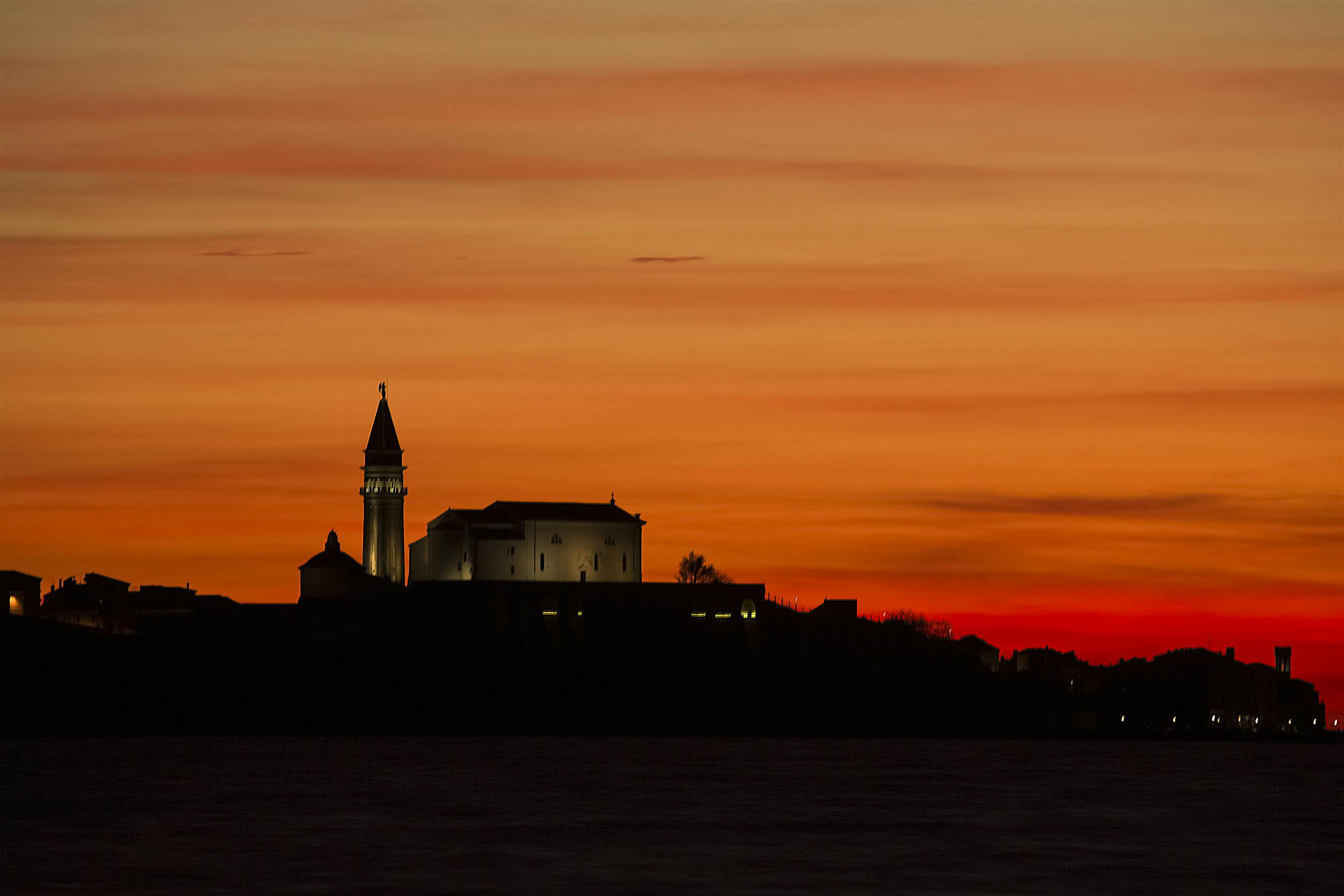 Travel News - sunset Slovenia A church in Piran during sunset.